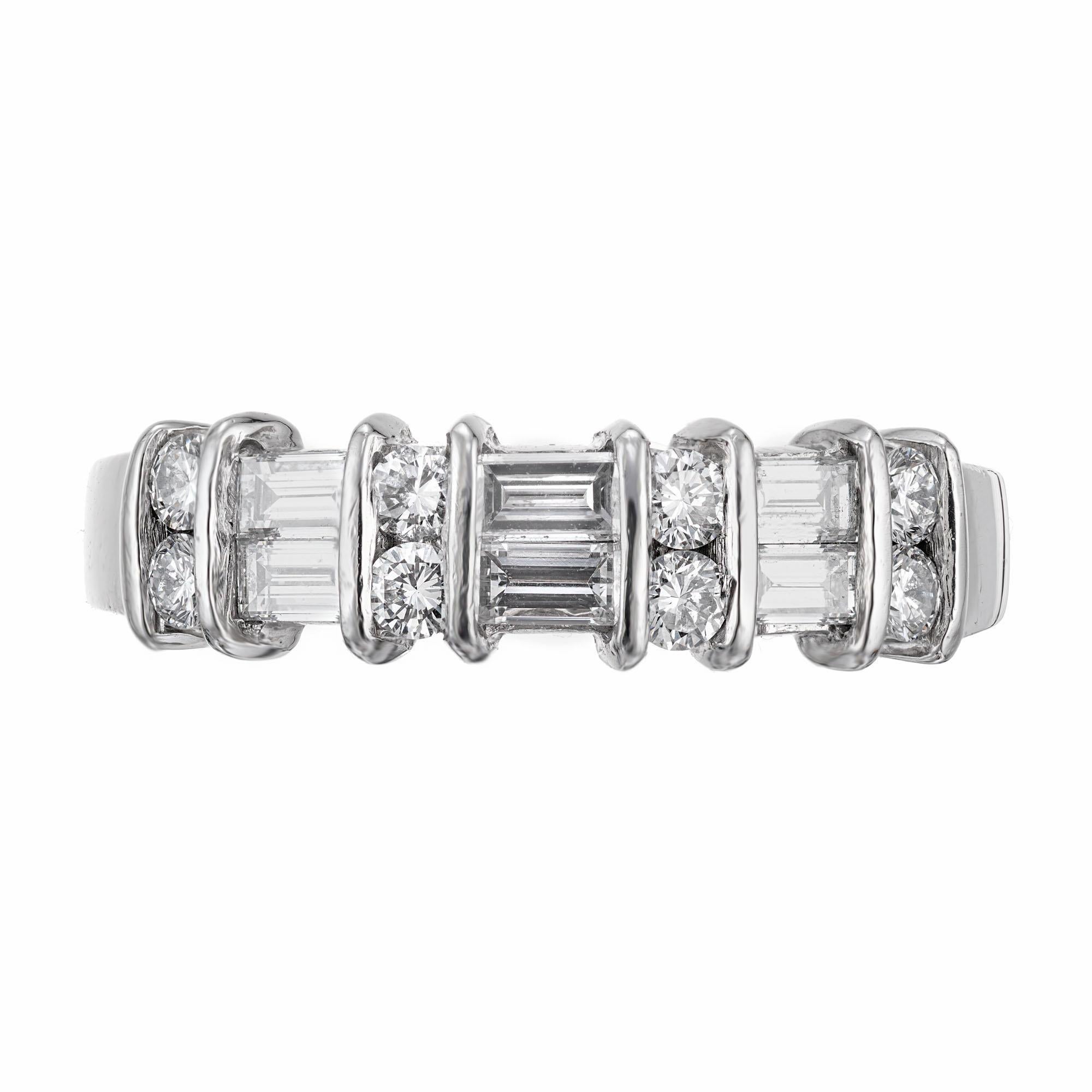 Diamond wedding band ring. 8 round ideal cut diamonds alternating with 6 baguette cut diamonds in a platinum setting.  

8 round Ideal cut diamonds, approx. total weight .25cts, F, VS
6 baguette diamonds, approx. total weight .30cts, F, VS, 3.14 x