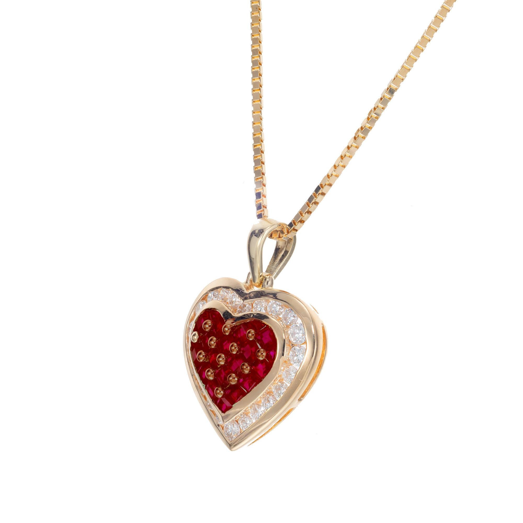 Heart shaped 14k yellow gold pendant set with 21 square cut rubies and a halo of full cut diamonds on a 18 inch box chain. 

21 square cut red rubies, approx. .55cts
22 full cut diamonds, G VS approx. .40cts
14k yellow gold
Stamped: 14k 585
5.9