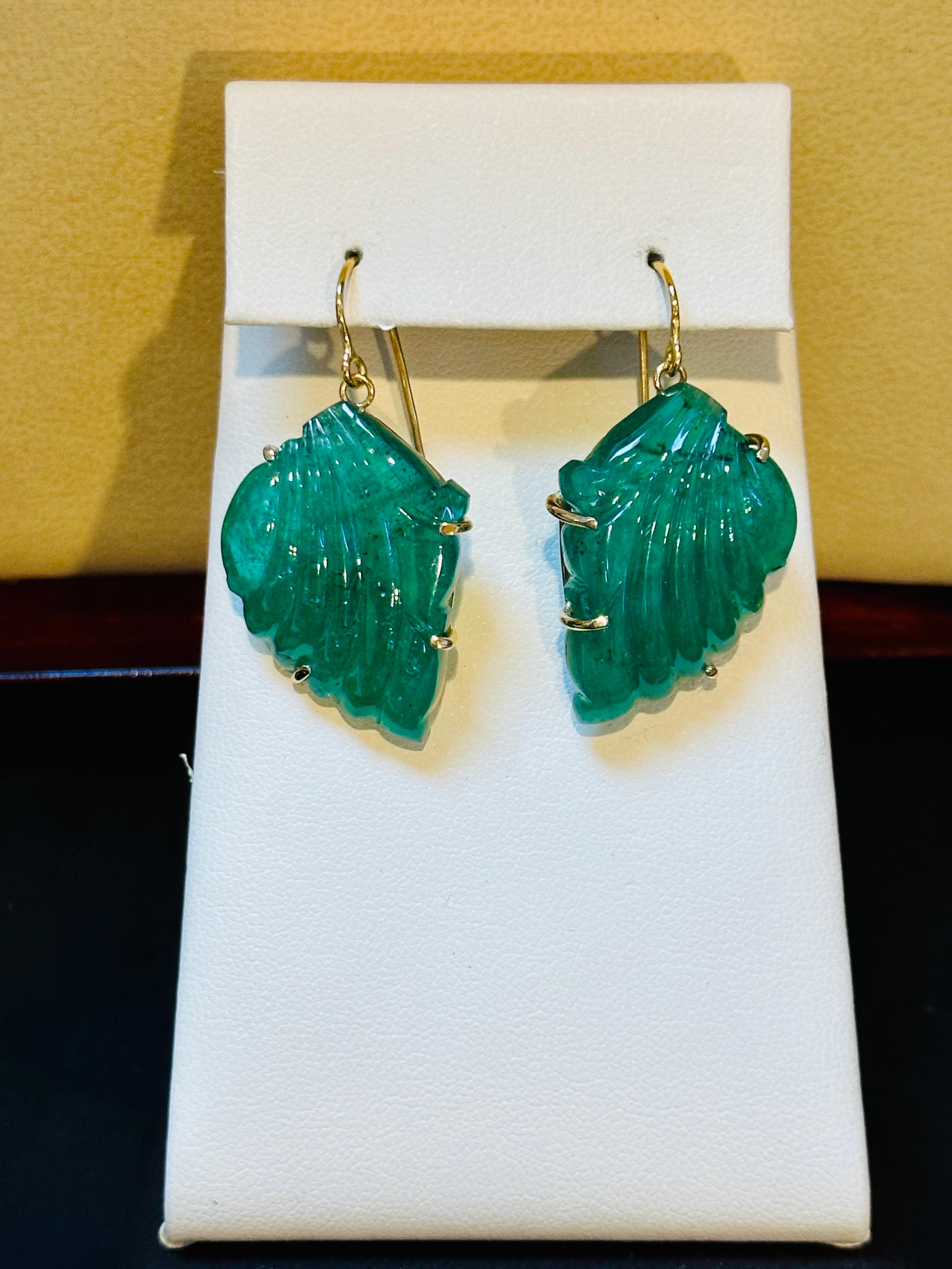 55 Ct Carved Emerald Leaf Shape Earrings 14 Kt Yellow Gold French Wire Earring In Excellent Condition For Sale In New York, NY