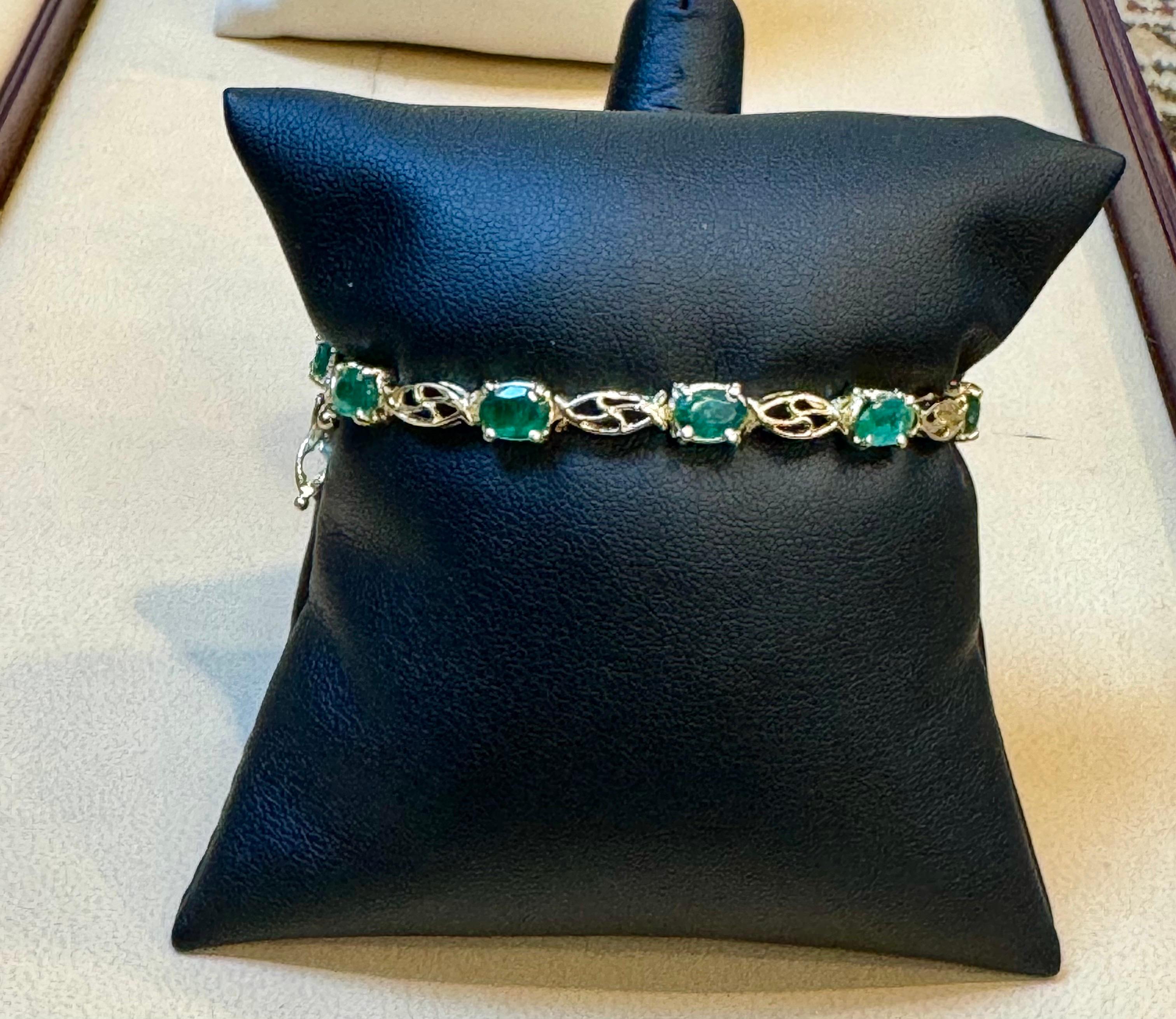 5.5 Carat Natural Emerald &  0.25 ct Diamond Cocktail Tennis Bracelet 14 Karat Yellow Gold
 This exceptionally affordable Tennis  bracelet has  11 stones of oval  Emeralds  .  Total weight of the Emeralds is  approximately 5.5 carat. 
The bracelet