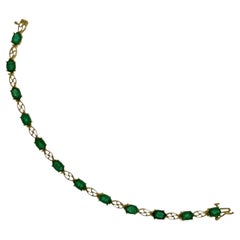 Bracciale tennis con smeraldo naturale e diamanti da 5,5 carati in oro giallo 14 carati
