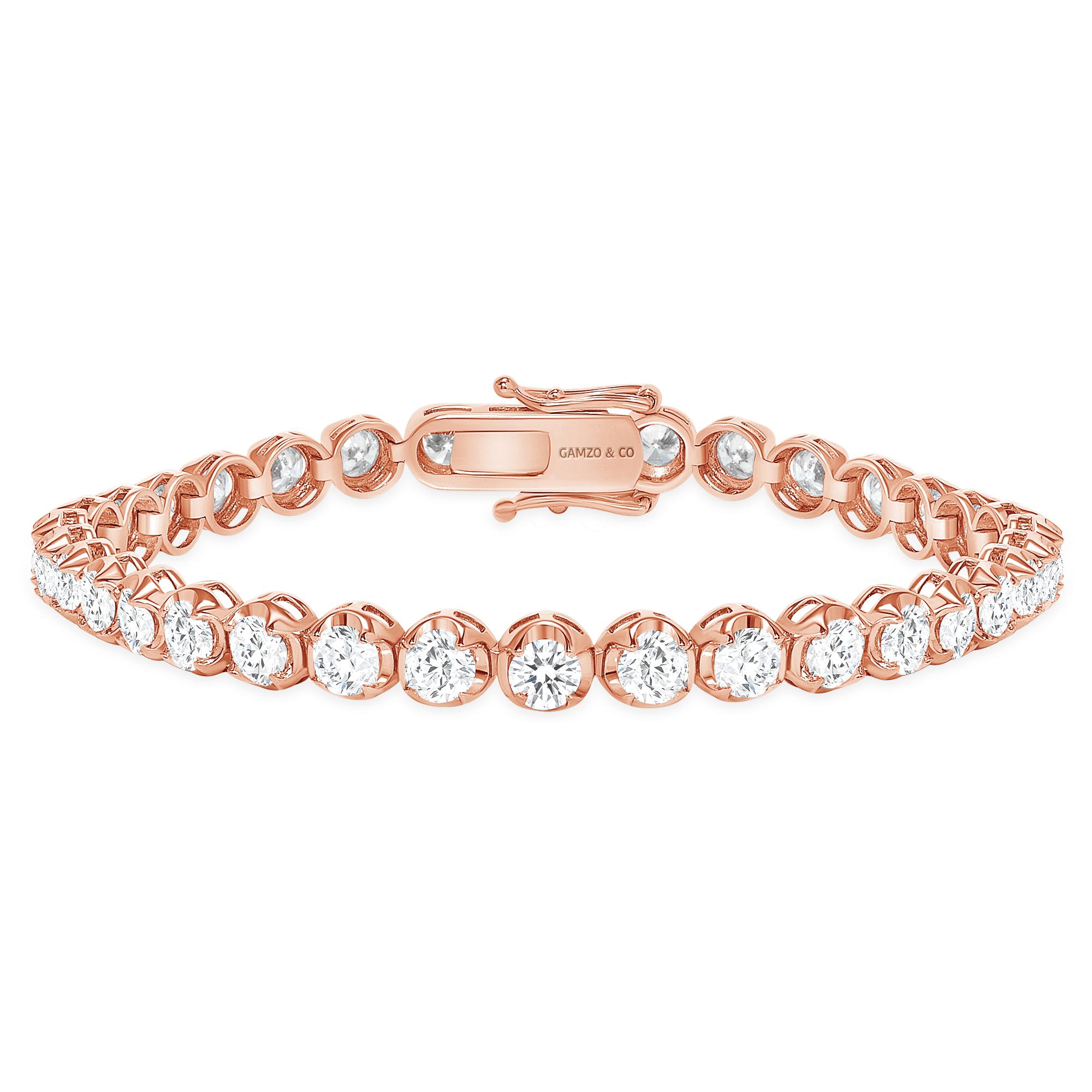 These beautiful round diamonds dance around your wrist as they absorb light and attention.
Metal: 14k Gold
Diamond Cut: Round
Diamond Total Carats: 5ct
Diamond Clarity: VS
Diamond Color: F
Color: Rose Gold
Bracelet Length: 5.5 Inches 
Included with