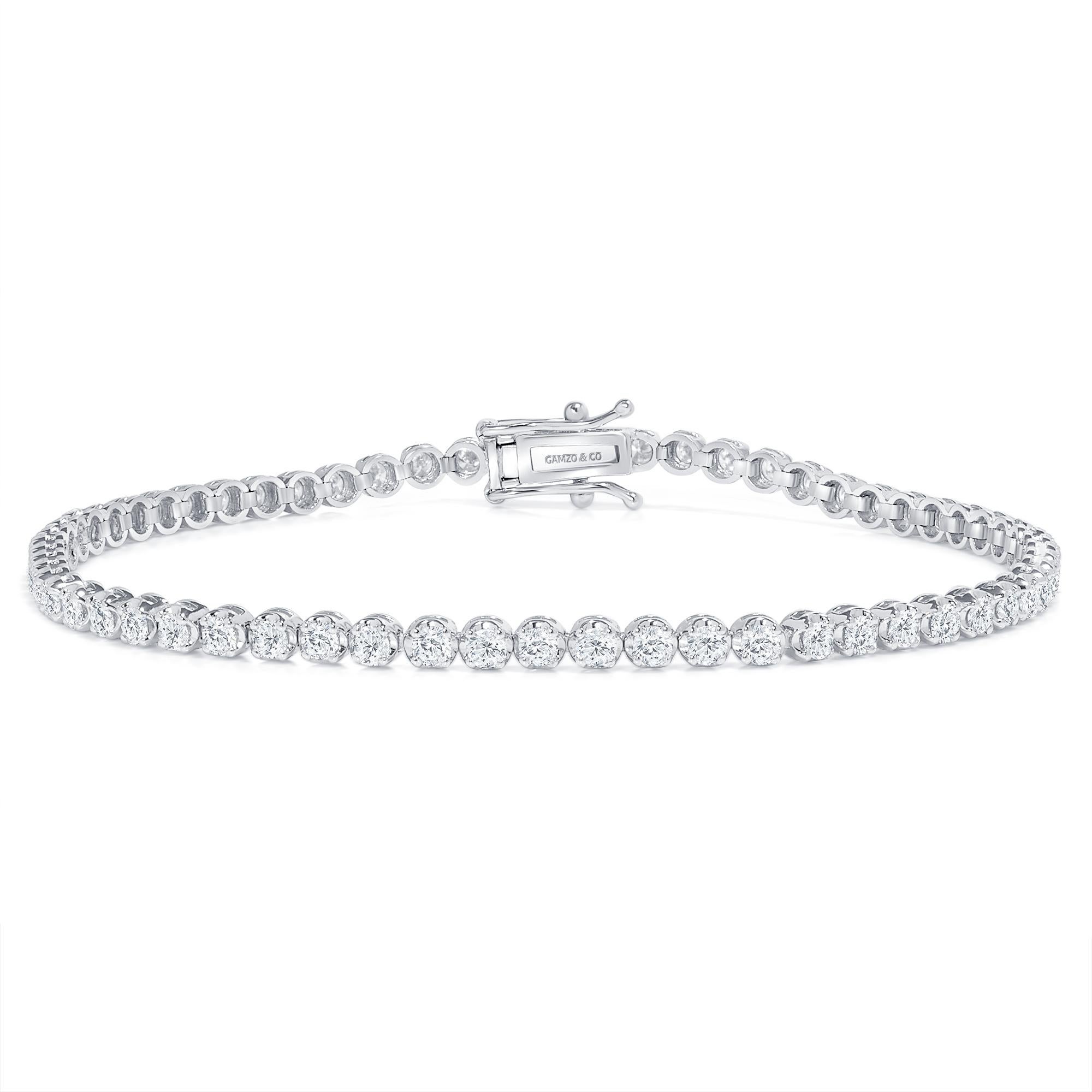 These beautiful round diamonds dance around your wrist as they absorb light and attention.
Metal: 14k Gold
Diamond Cut: Round
Diamond Total Carats: 3ct
Diamond Clarity: VS
Diamond Color: F
Color: White Gold
Bracelet Length: 5.5 Inches 
Included with