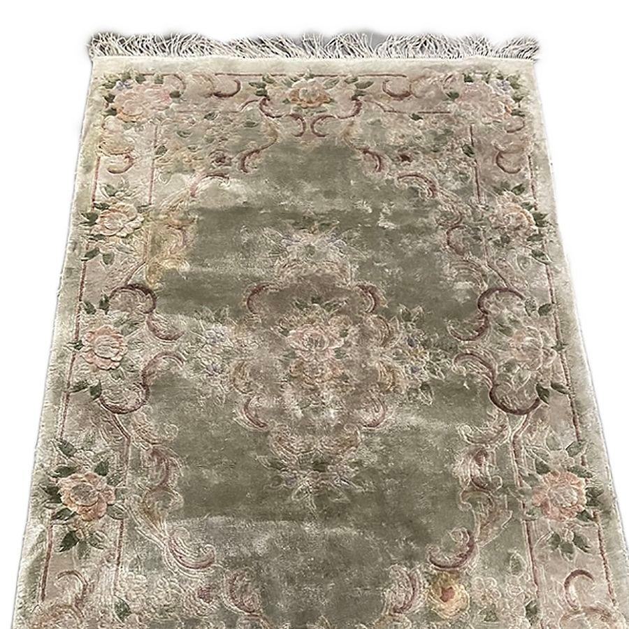 Large Wool on cotton Taupe/ Green Floral Nepalese area rug with pink floral motifs throughout the entirety of the rug.

Measurements: 66