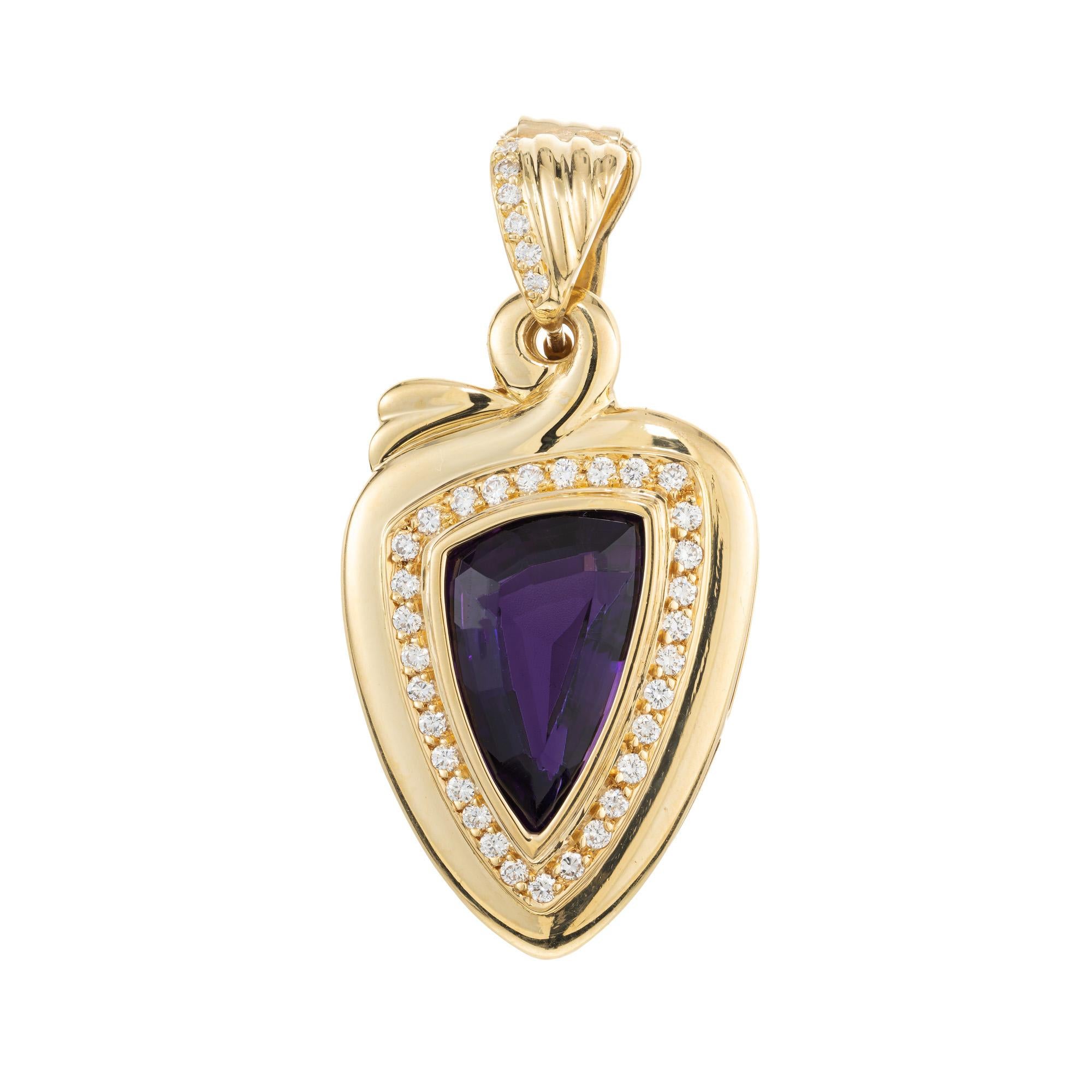 Vintage amethyst and diamond pedant enhancer. Triangular 5.50crt. center amethyst set in a 14k yellow gold pendant setting accented with 38 round brilliant cut diamonds, formed into a halo and along the bail. 

1 free form triangular purple