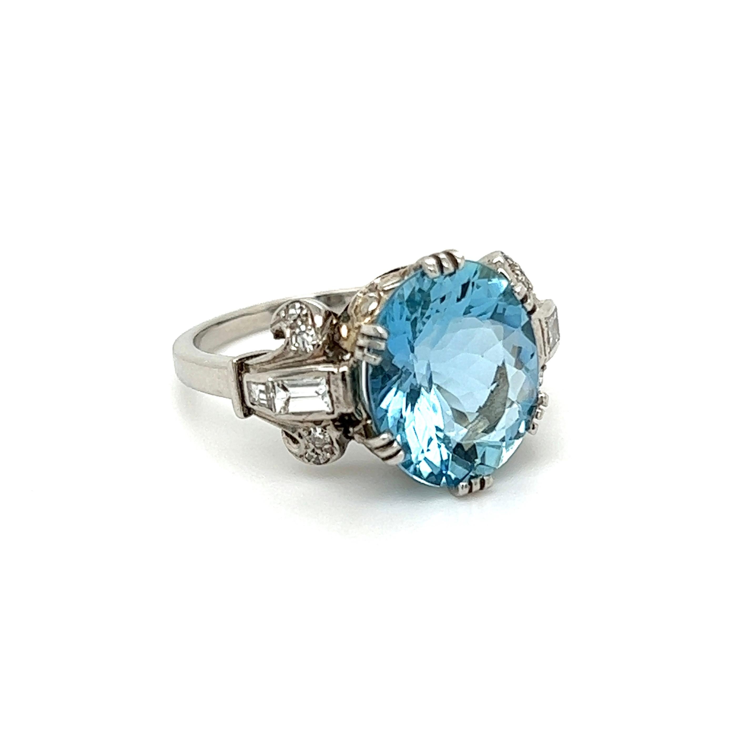Simply Beautiful! Finely detailed Aquamarine and Diamond Gold Late Art Deco Cocktail Ring. Centering a securely nestled Hand set Oval Aquamarine, weighing approx. 5.50 Carats, either side set with Diamonds, approx. 0.30tcw. Approx. Dimensions: 1.00”