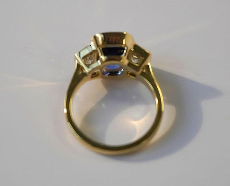 Cushion Cut 5.50 Carat Ceylon Sapphire Three-Stone Bezel Ring For Sale