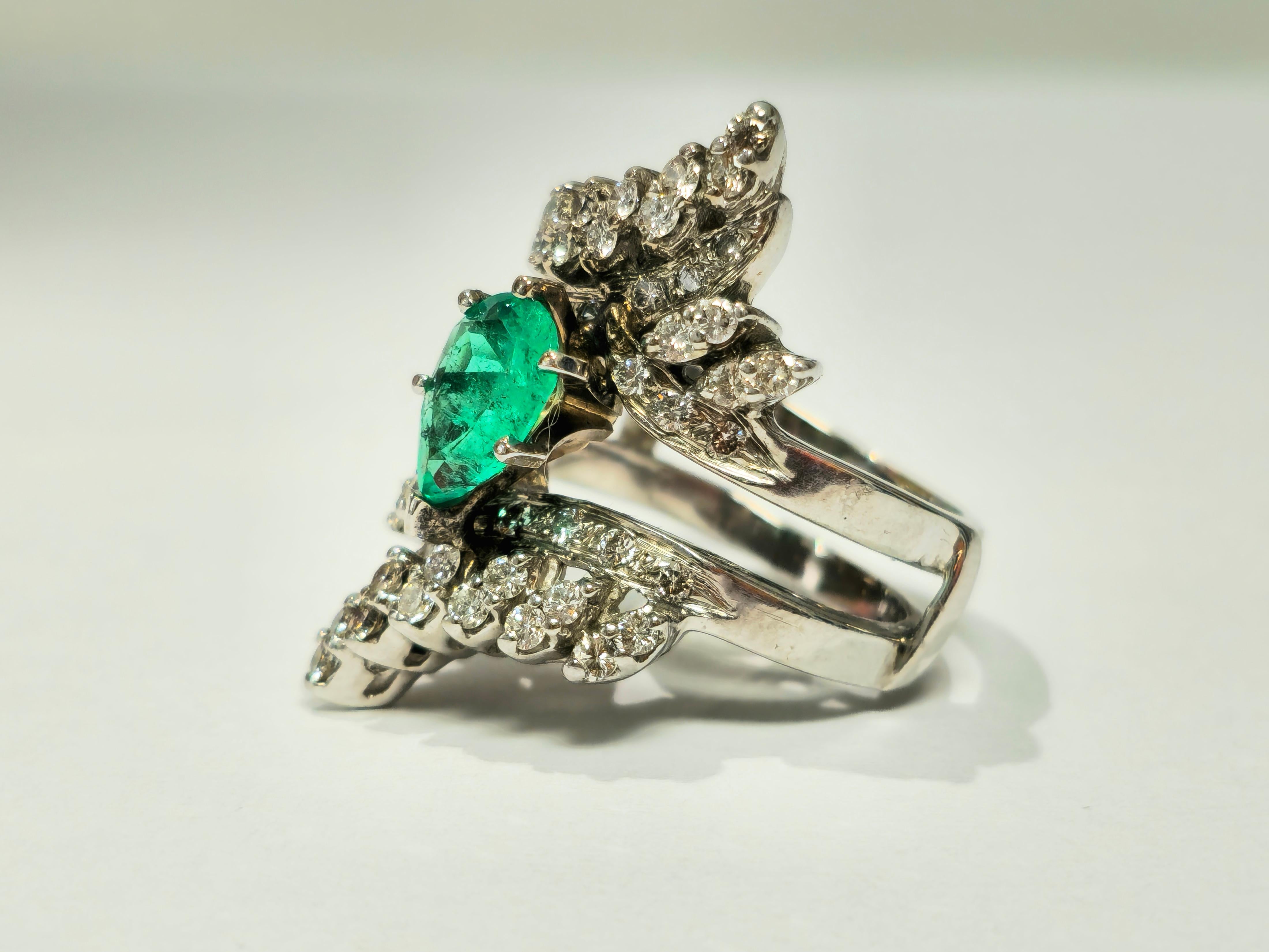 Crafted in lustrous 14k white gold, this stunning ring boasts a magnificent 3.50 carat Colombian emerald, pear-shaped and elegantly set in prongs, exuding natural beauty and allure. Complementing the emerald are brilliant diamonds totaling 2.00