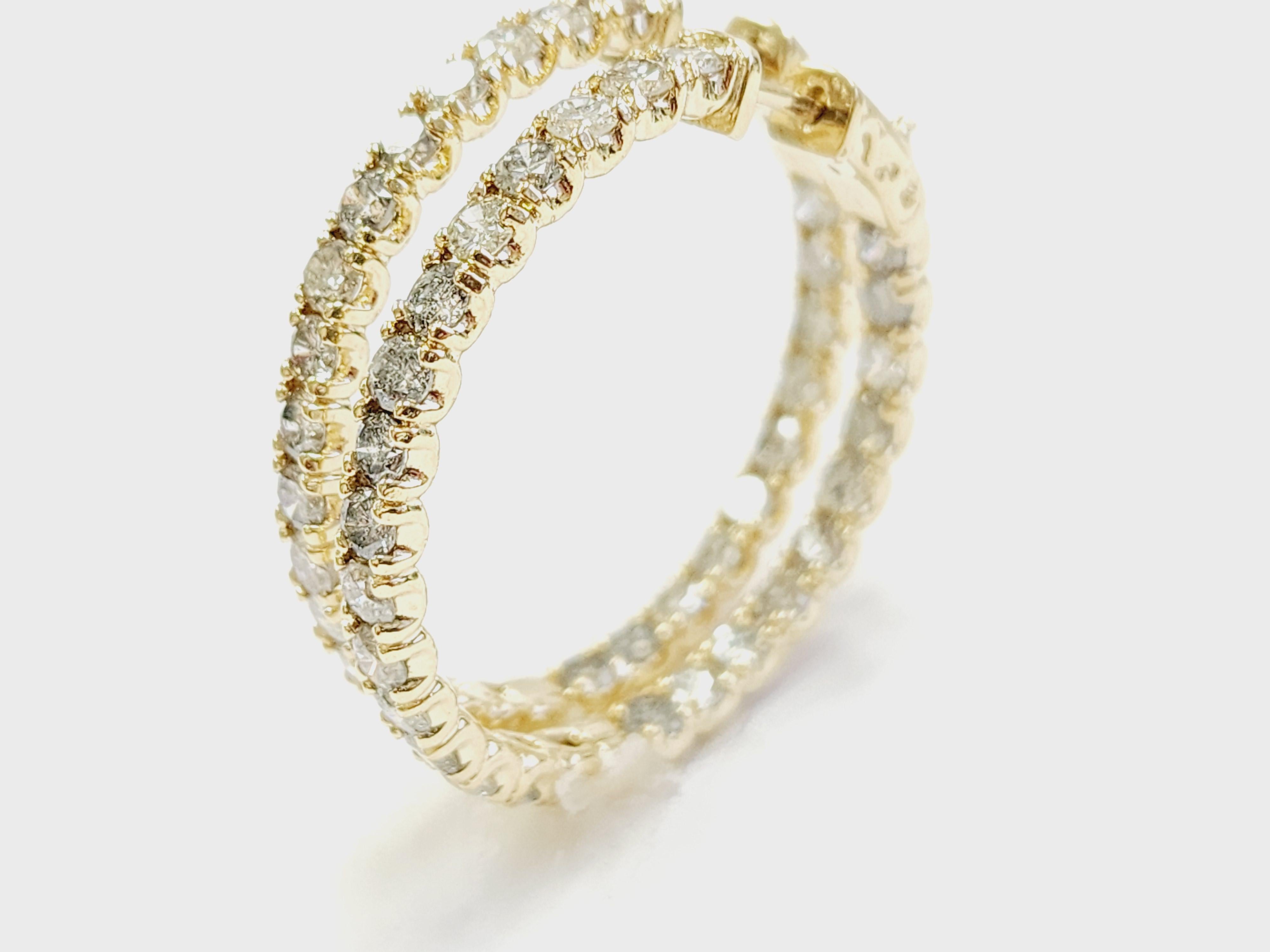 Beautiful pair of natural diamond inside out hoop earrings in 14k yellow gold. 
Secures with snap closure for wear. Average Color G, Clarity I2, Measures 1.25 inch.
*Free shipping within the U.S*