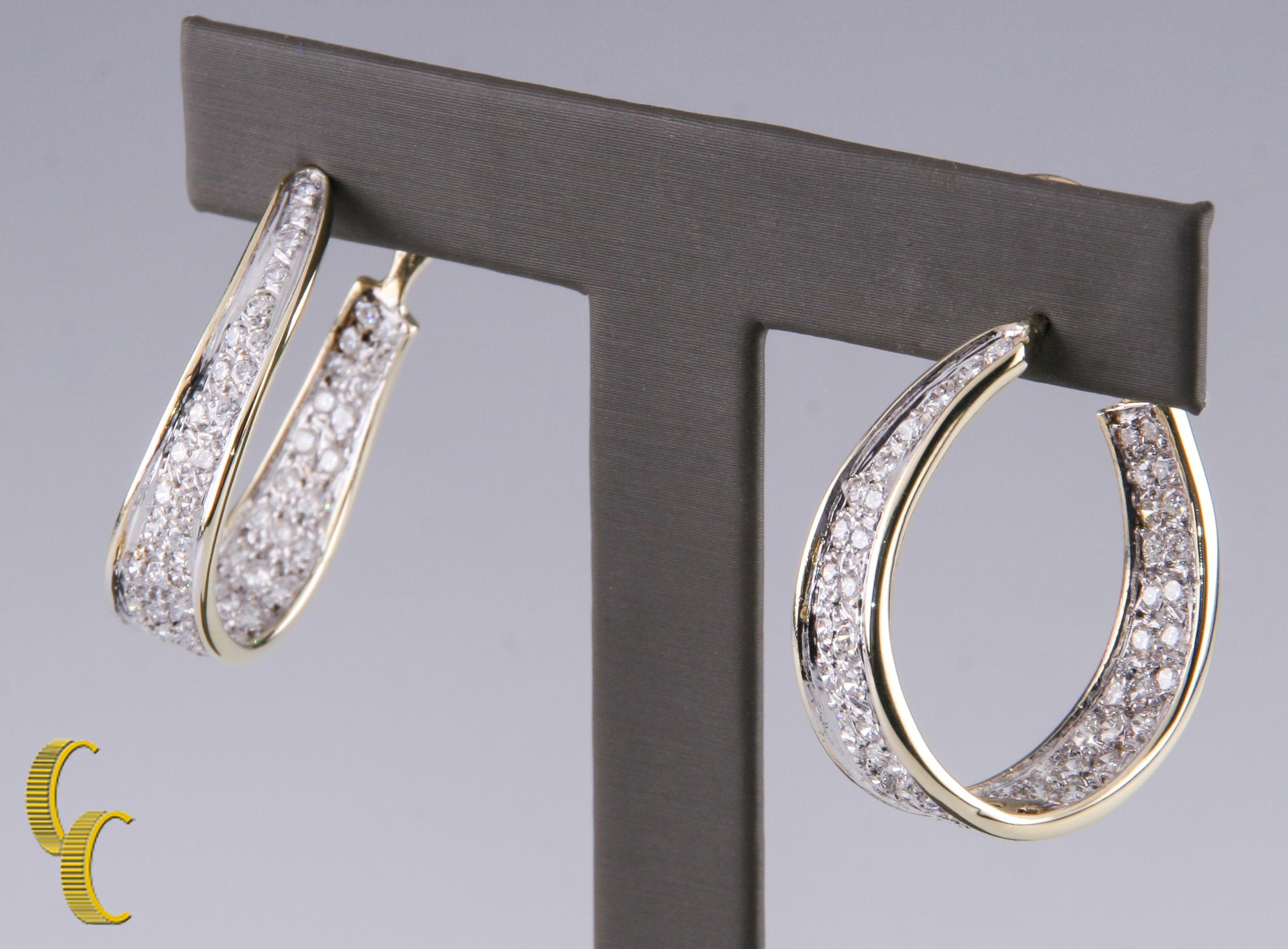 Gorgeous Two-Tone Gold Ribbon-like Hoop Earrings w/ Pave-Set Round Brilliant Diamonds
Total Diamond Weight = 5.5 carats
Average Color = G - H
Average Clarity = VS - SI
Length of Drop = 33 mm
Width of Hoop (at Widest) = 8 mm
Total Mass = 13.9