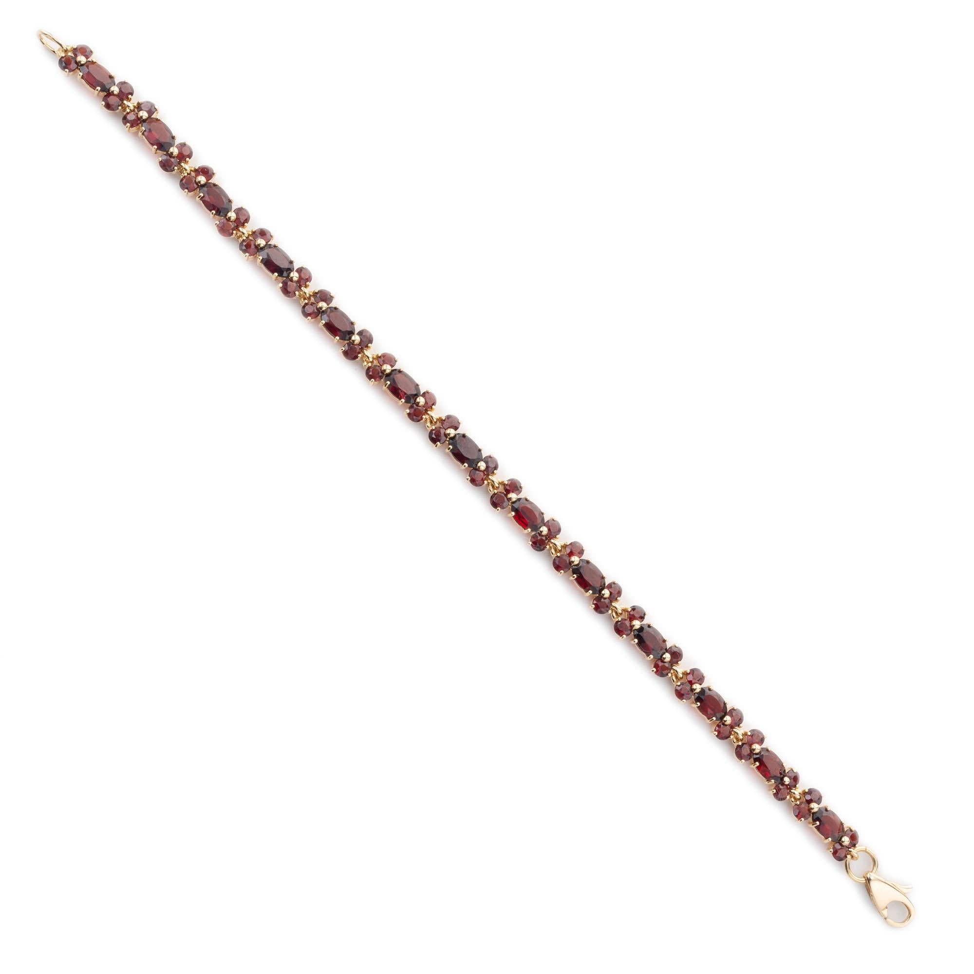 Garnet bracelet in solid 18k yellow gold. 13 oval garnets with 53 round garnet separators. 7.5 inches long. 

13 oval brownish red garnets, approx.  3.00cts
53 round brownish red garnets, approx. 2.50cts
18k yellow gold 
Stamped: 750
11.1