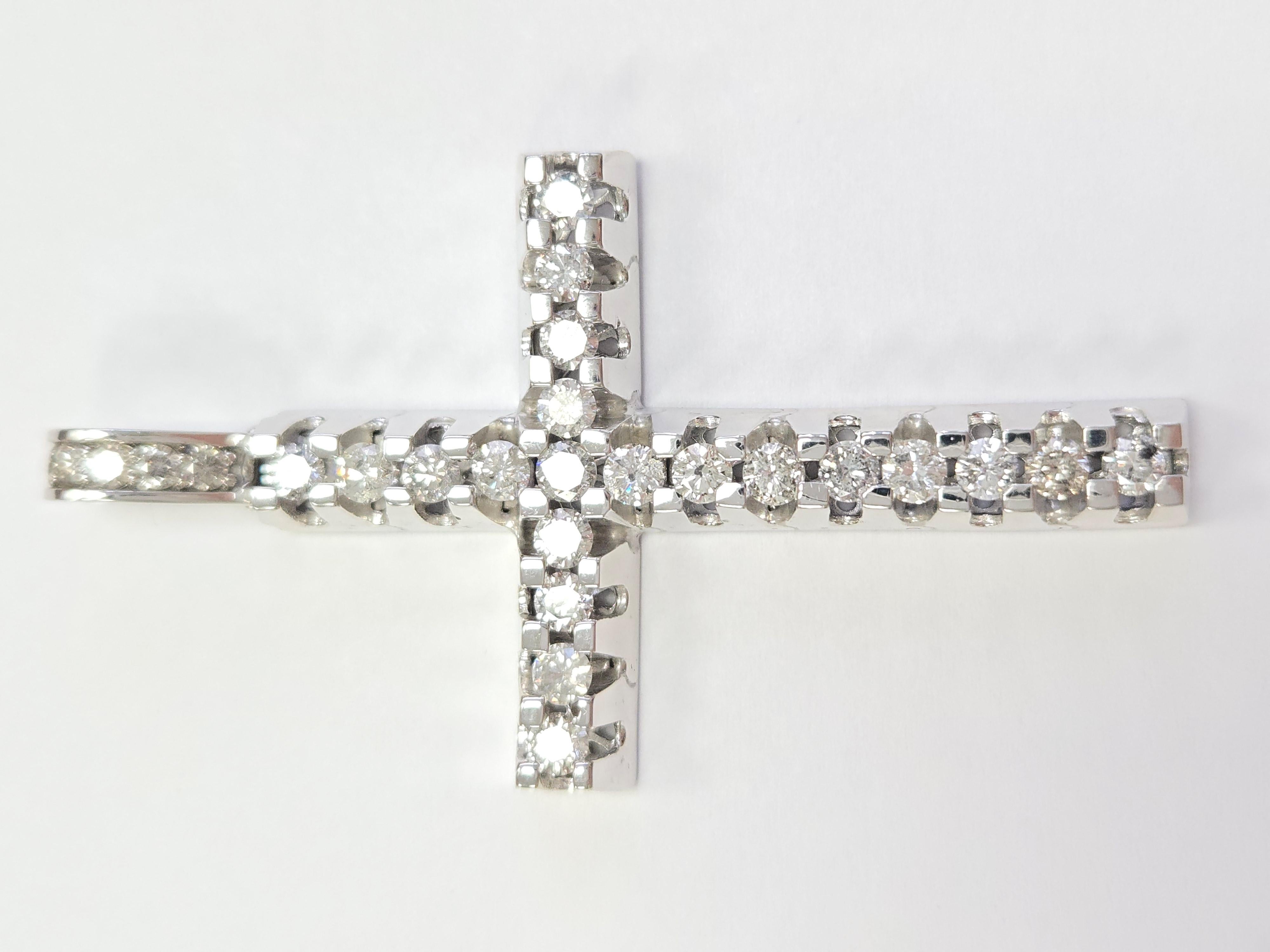Beautiful 14 karat white gold and diamond cross pendant. A total weight of 5.50 carats round cut diamonds very sparkly and shiny look.

Average Color: G
Average Clarity: I2
26 Pieces Natural Diamonds
Measurements: 2.80 L x  1.60 W x 0.25 D inch