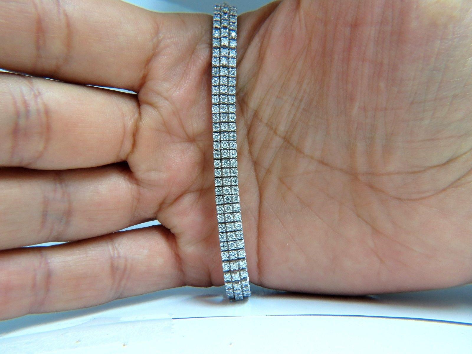 5.50ct. Natural diamonds Three row bracelet.

Rounds, full cut.

G color Vs-2 clarity.

14kt. white gold 

20.1 Grams.

.26 inch wide

7 inch long (wearable length)

secure clasp.

$11,000 Appraisal to accompany.