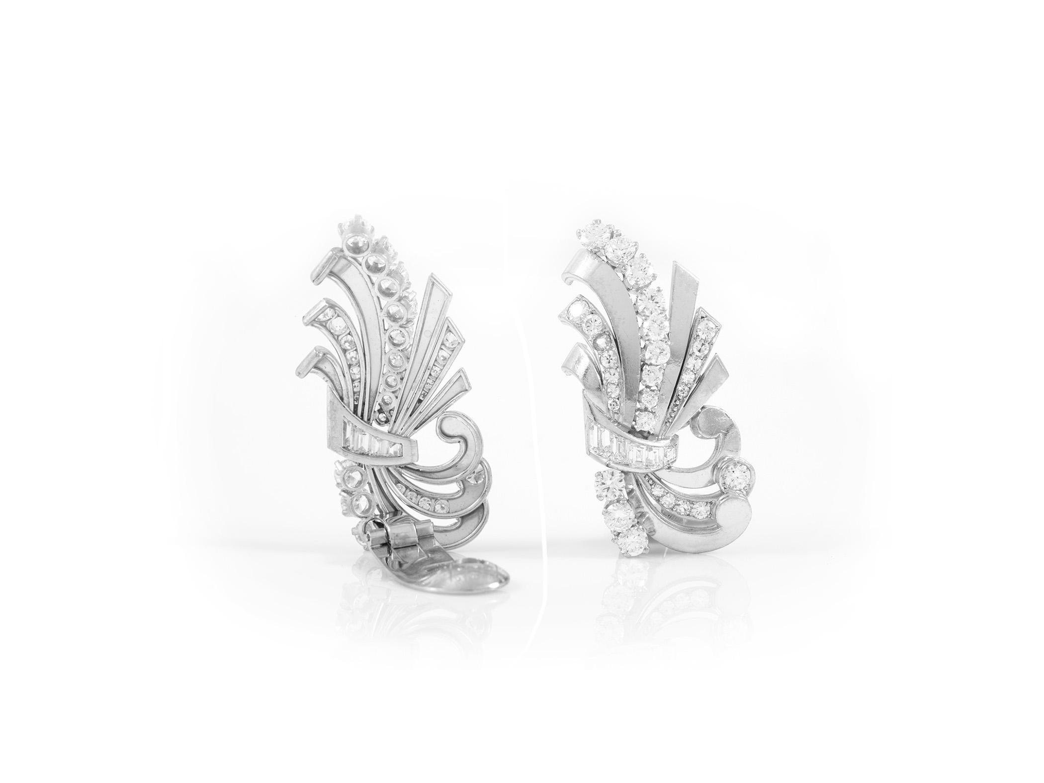 The earrings are finely crafted in platinum with diamonds weighing approximately total of 5.50 carat.