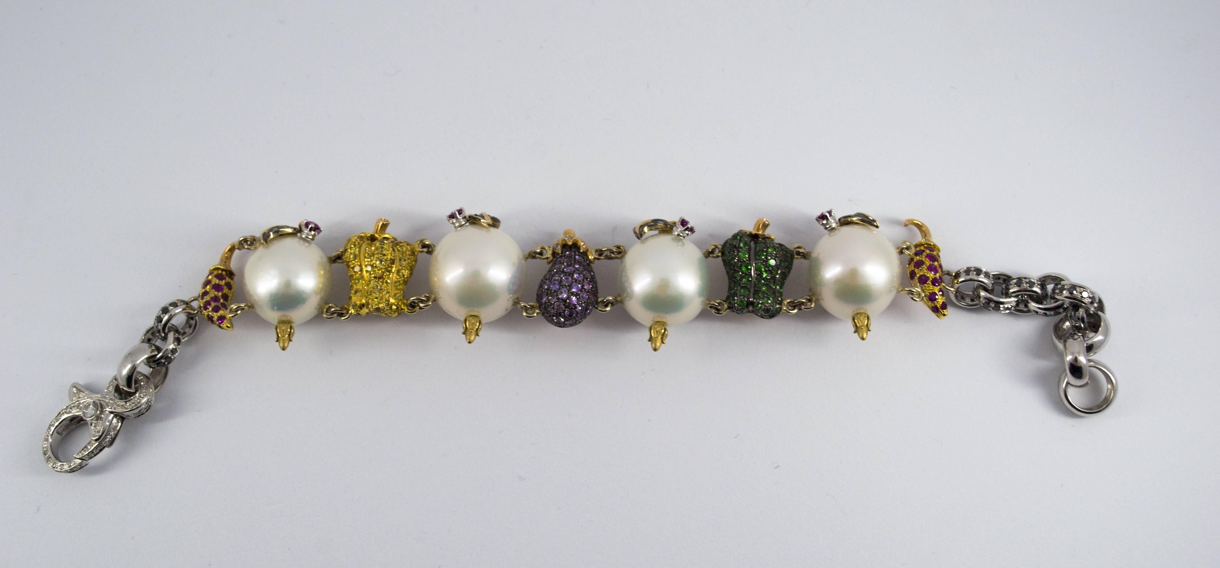 This Bracelet is made of 18K White and Yellow Gold.
This Bracelet has 0.85 Carats of Diamonds.
This Bracelet has 5.50 Carats of Peridots, Rubies, Yellow Sapphires.
This Bracelet has also Pearl.
We're a workshop so every piece is handmade,
