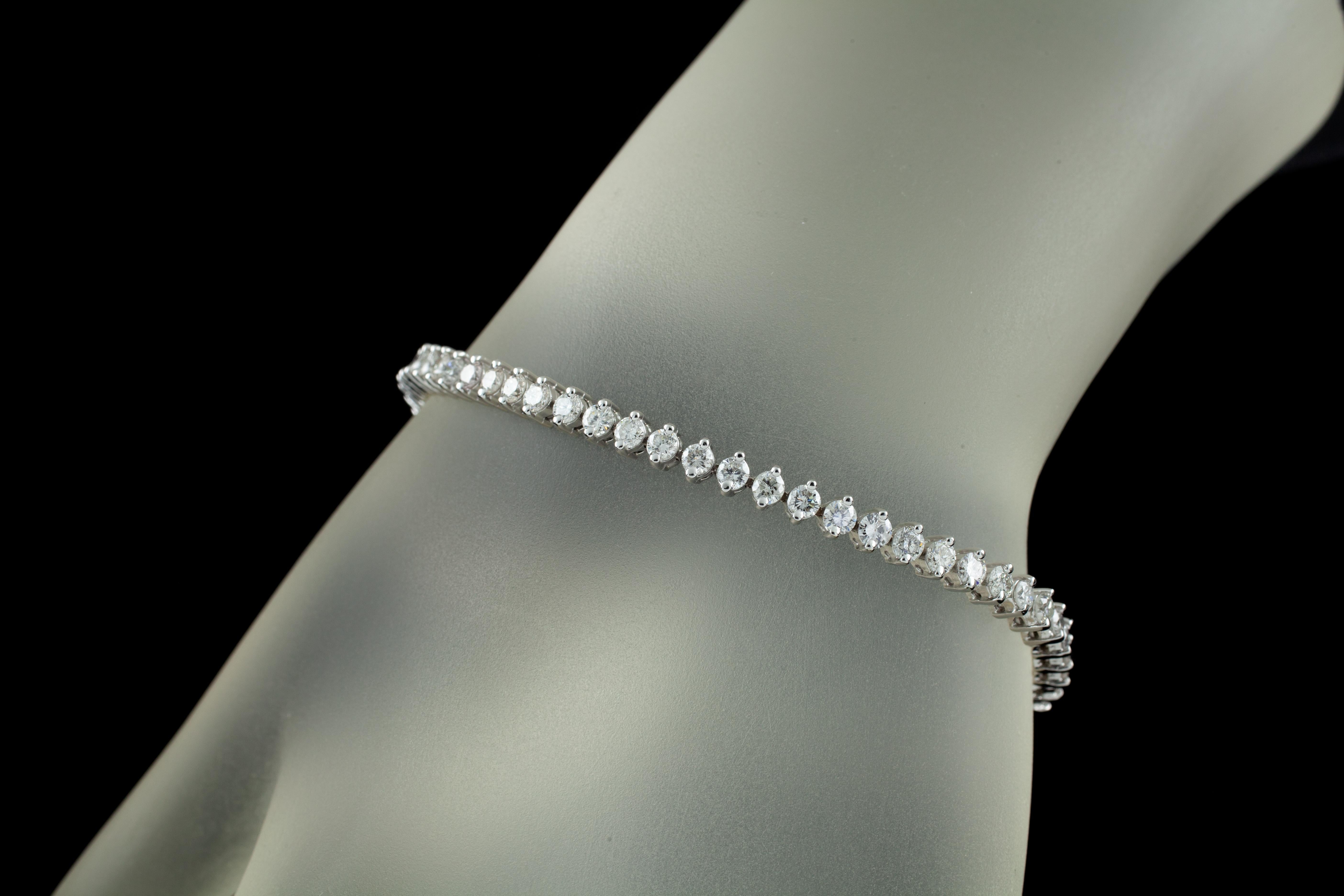 Gorgeous 14k White Gold Tennis Bracelet!
Features Approximately 5.50 ct of Round Diamonds in Prong Settings
Average Color = G - H
Average Clarity = SI
Total Length = 6.75