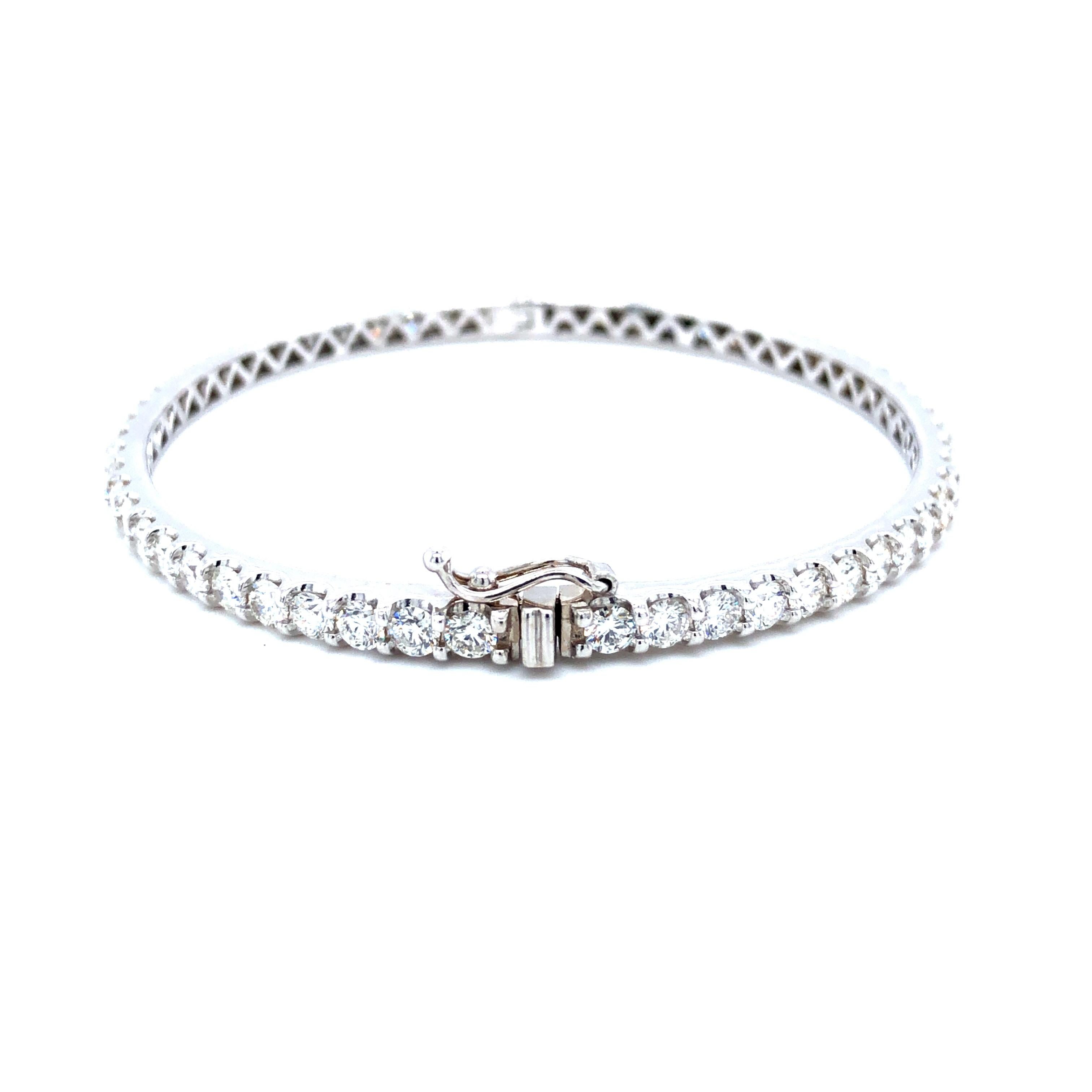 Offered here is a a gorgeous 5.50 carats all around diamond bangle set in 14kt gold. The bangle is set with 56 natural round brilliant cut diamonds all G color Vs2- Si1 in clarity with an estimated total diamond weight of 5.50 carats. The bangle is