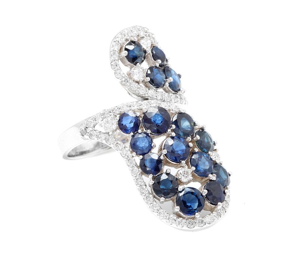 5.50 Carats Exquisite Natural Blue Sapphire and Diamond 14K Solid White Gold Ring

Suggested Replacement Value Approx. $6,800.00

Total Natural Blue Sapphires Weight is: Approx. 4.50 Carats 

Sapphire Treatment: Untreated

Natural Round Diamonds