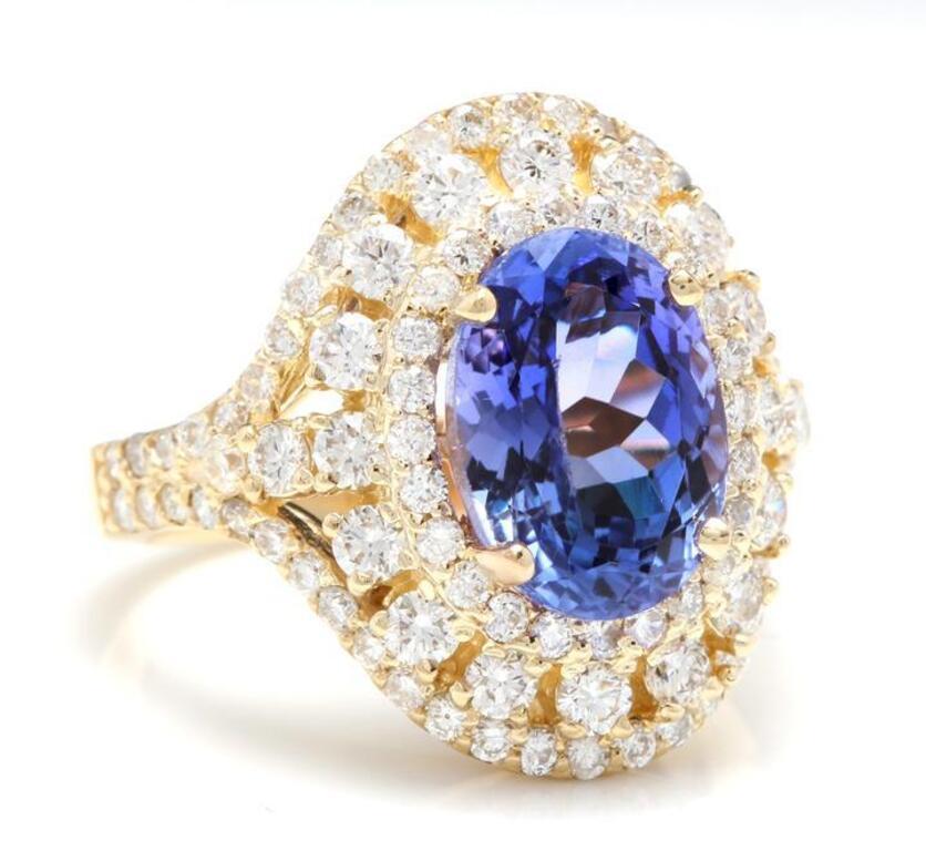 5.50 Carats Natural Splendid Tanzanite and Diamond 14K Solid Yellow Gold Ring

Total Natural Oval Cut Tanzanite Weight is: Approx. 4.00 Carats

Natural Round Diamonds Weight: Approx. 1.50 Carats (color G-H / Clarity SI)

Ring size: 7 (we offer free