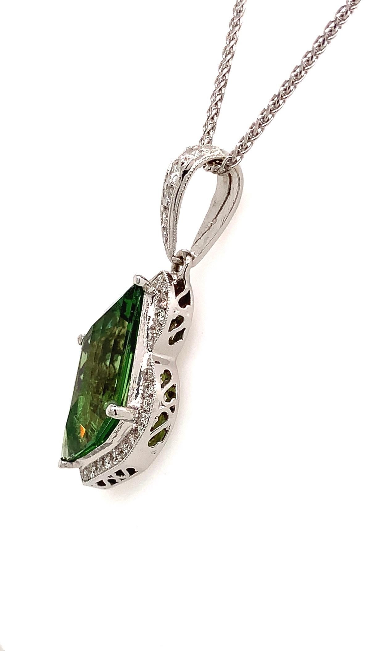 Green Garnets (Tsavorites) over 5 carats, have become very expensive. This fancy leaf cut Tsavorite is 5.50 carats, it is loupe clean and cut by Bill Vance. We had to make a custom pendant, because of the stones unusual shape. We decided to make the