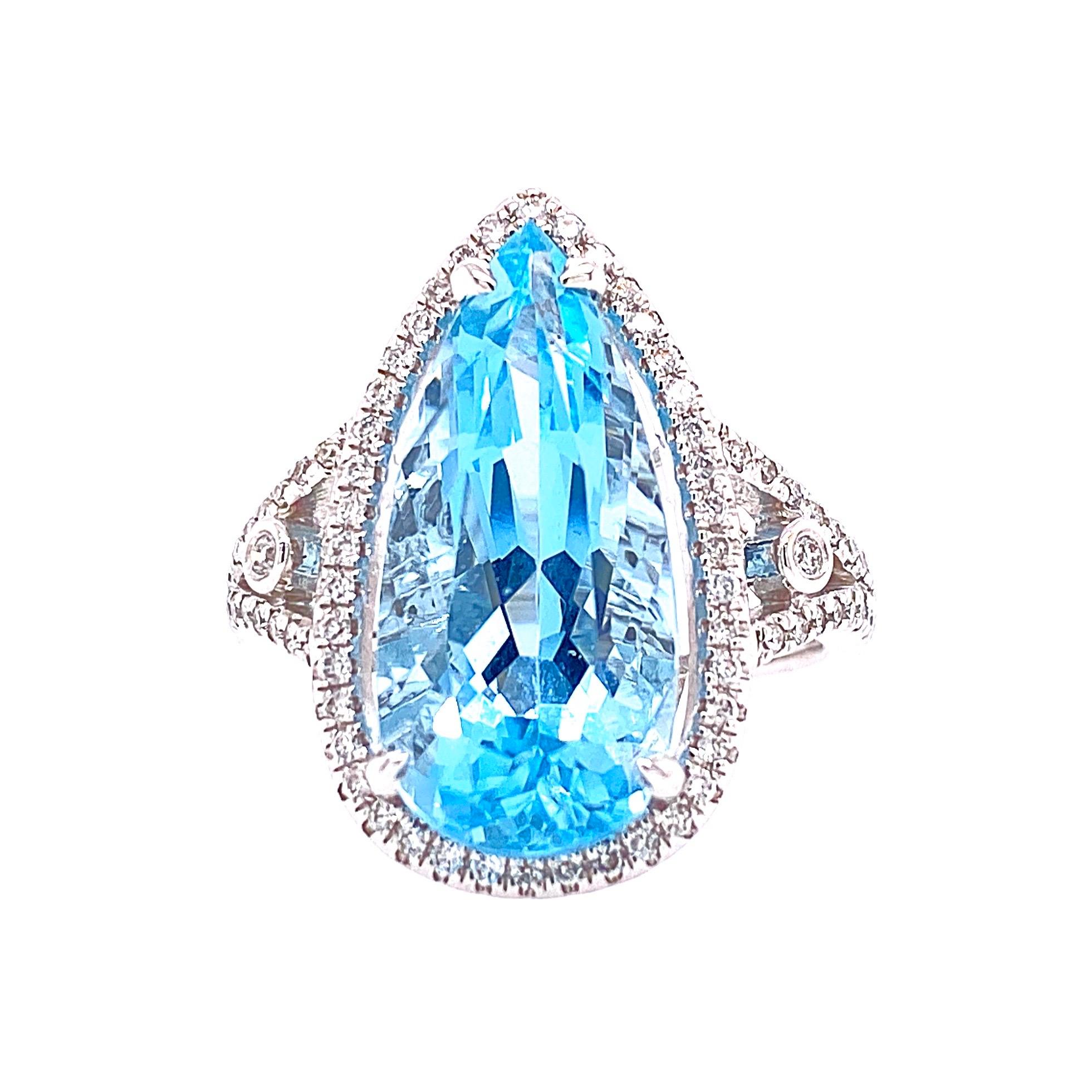 This stunning Cocktail Ring features a beautiful 5.50 Carat Pear Aquamarine with a Diamond Halo. The Aquamarine sits on a Double Diamond Shank and is set in 14K White Gold. Total Diamond Weight = 0.30 Carats. Ring Size is 6 1/2.