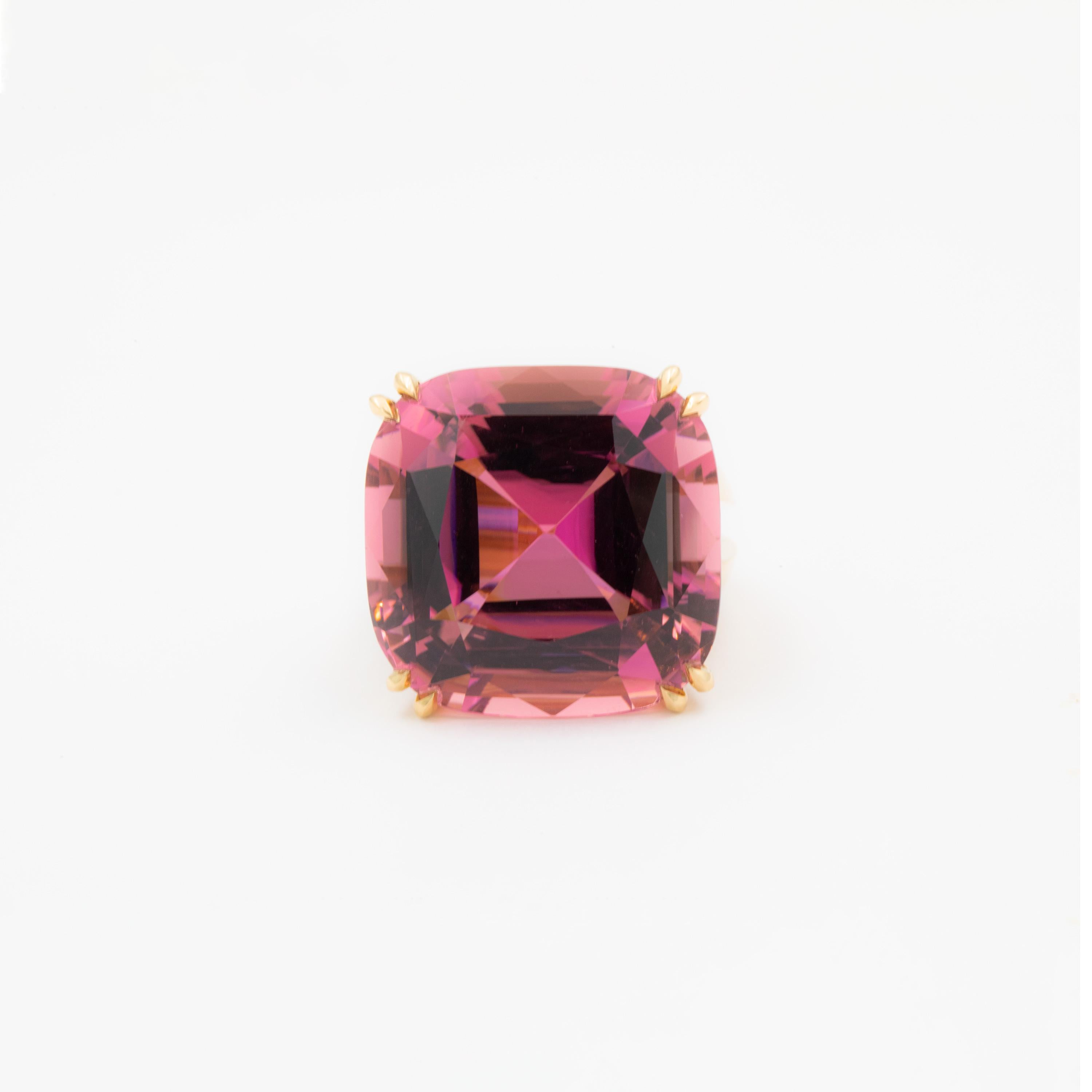 The opulent 55 carat Tourmaline set in this stunning piece was sourced in Mozambique and captivates with its vibrant rose-like color. Its cushion-cut shape perfectly emphasizes the natural vibrance of the deep yet light color of the stone. Designed