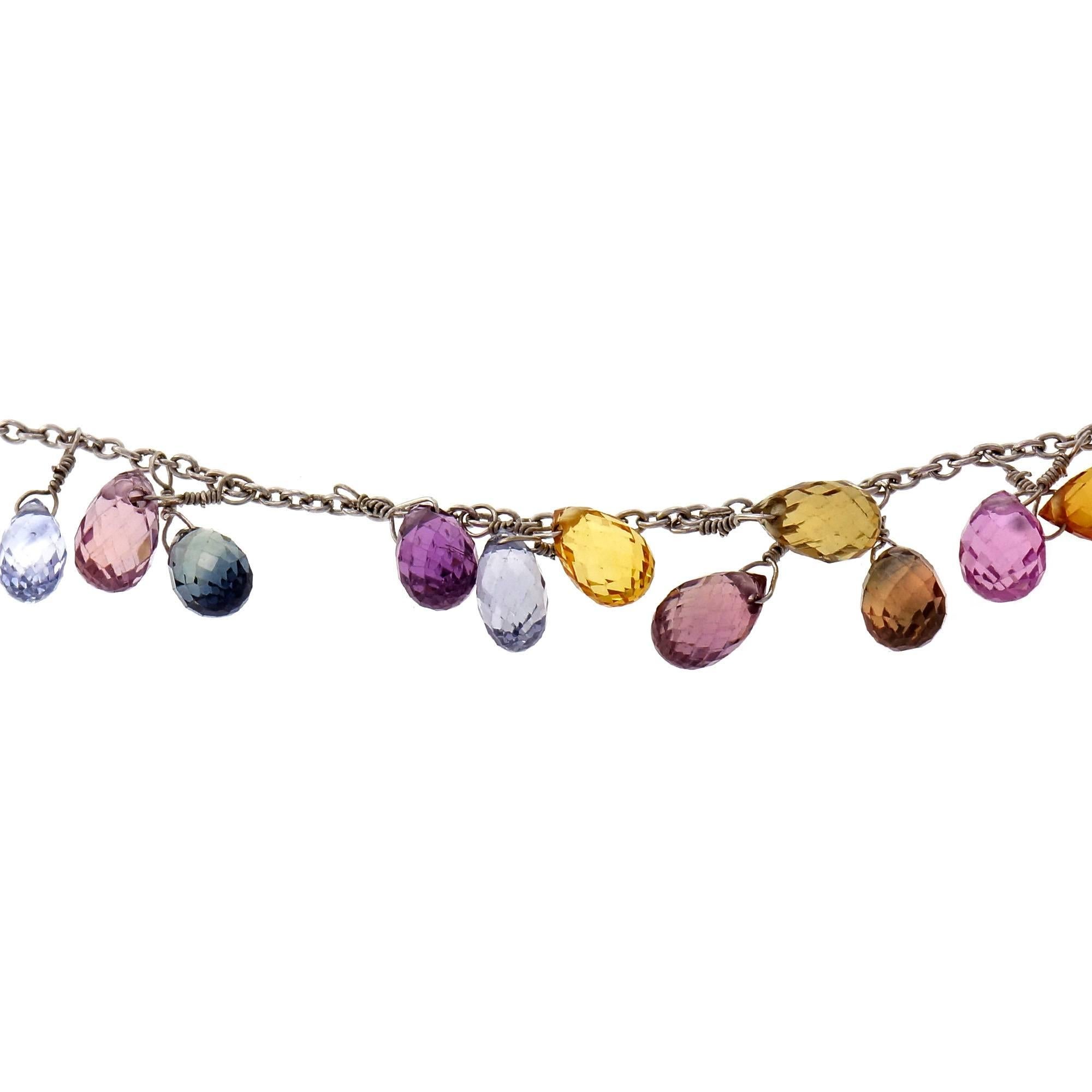 Multi-color genuine Sapphire hand wired Briolette necklace with 55 Sapphires in shades of blue, pink, yellow and green.

55 Briolette Sapphires, blue, pink, yellow and green, approx. total weight 55.00cts, 
18k white gold
13.9 grams 
Tested: 18k