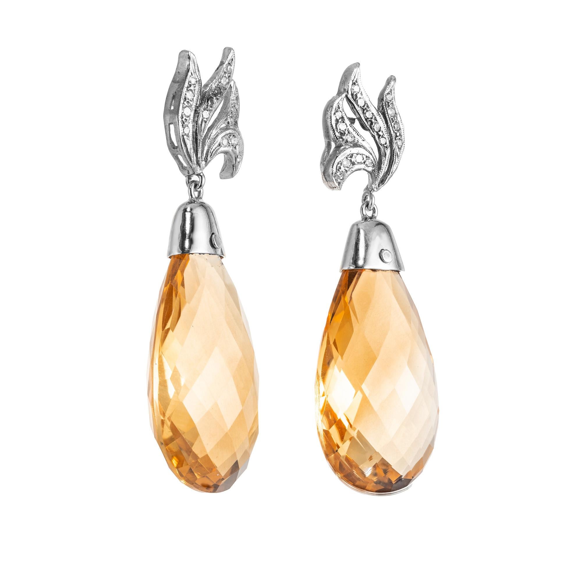 1950's swirl diamond top dangle earrings with natural untreated golden yellow Citrine Quartz Briolette dangles. 2 Stunning 55.00 carat  Citrines in 14k white gold settings accented with diamond swirl style tops. The dangle style of these earrings