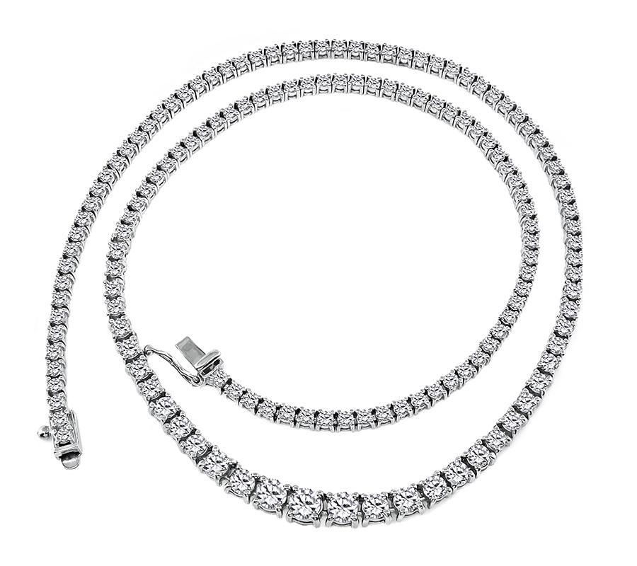 This is an elegant platinum necklace. The necklace is set with sparkling round cut diamonds that weigh approximately 5.50ct. The color of these diamonds is G-H with VS clarity. The necklace measures 16 inches in length and 4.5mm in width at the