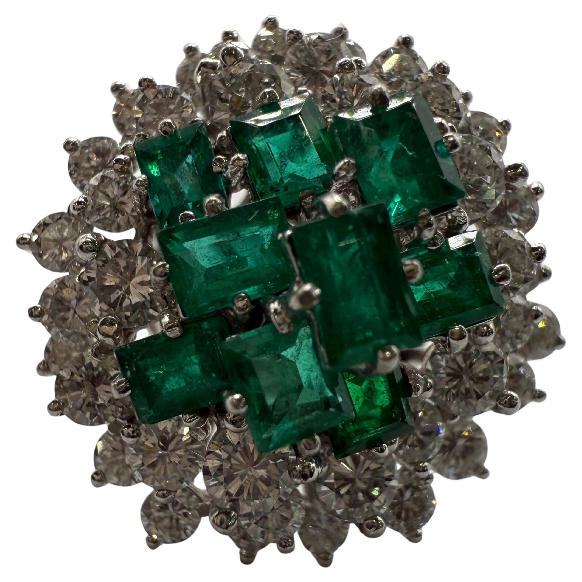 What a vibrant emerald and diamond ring, emeralds totaling 2.50 carats and diamonds 3 carats made in platinum with incredible design. You can see Art Deco motif in the ring but year is uknown.
Ring sized at 6 and can be re-sized to most