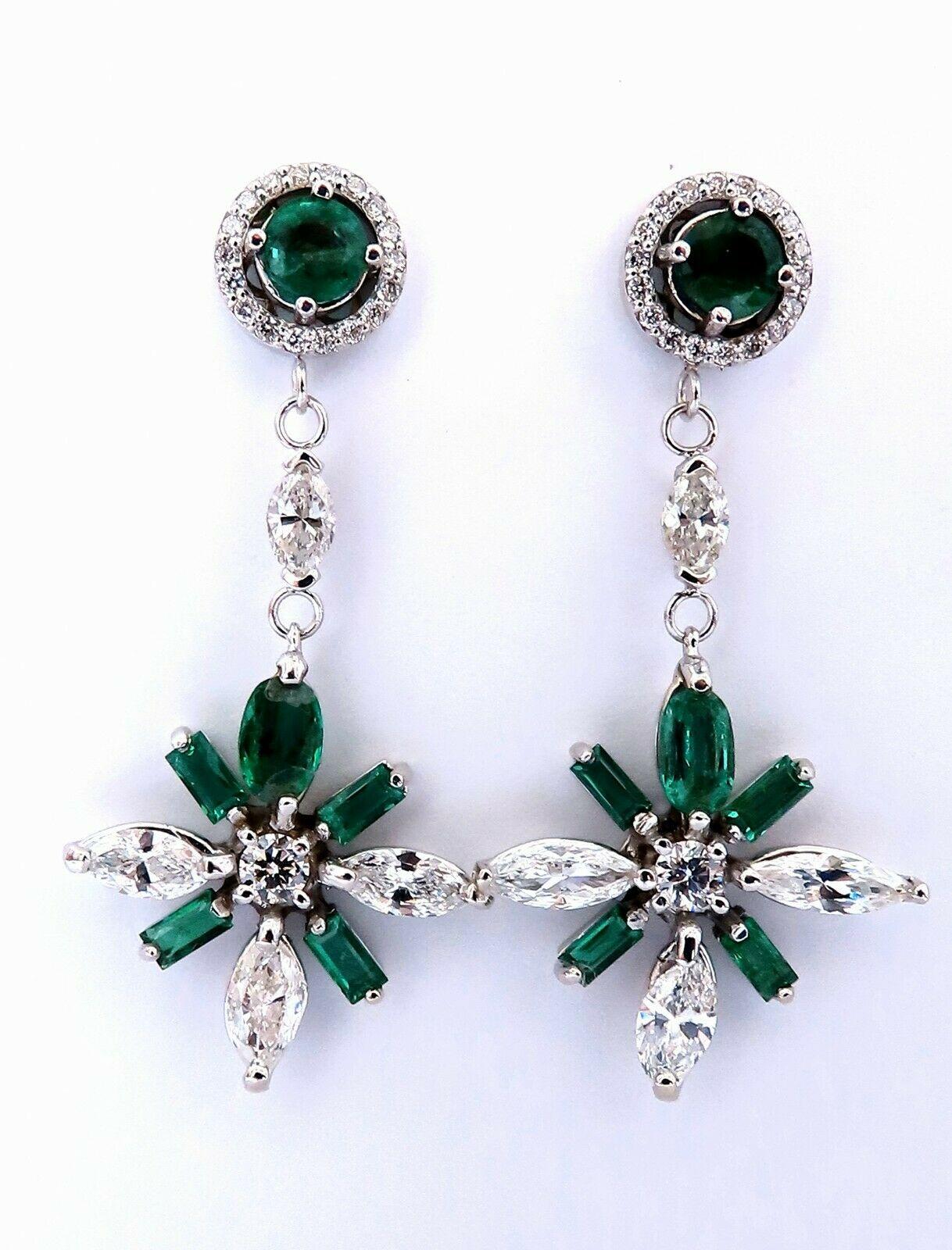 Snowflake Dangle cluster earrings.

3 carat natural round, Marquis and emerald cut emeralds.

Full cut brilliant clean clarity and transparent

2.50 carat round & marquis diamonds

H color vs2 clarity

14 karat white gold 8.9 g

Earrings measure