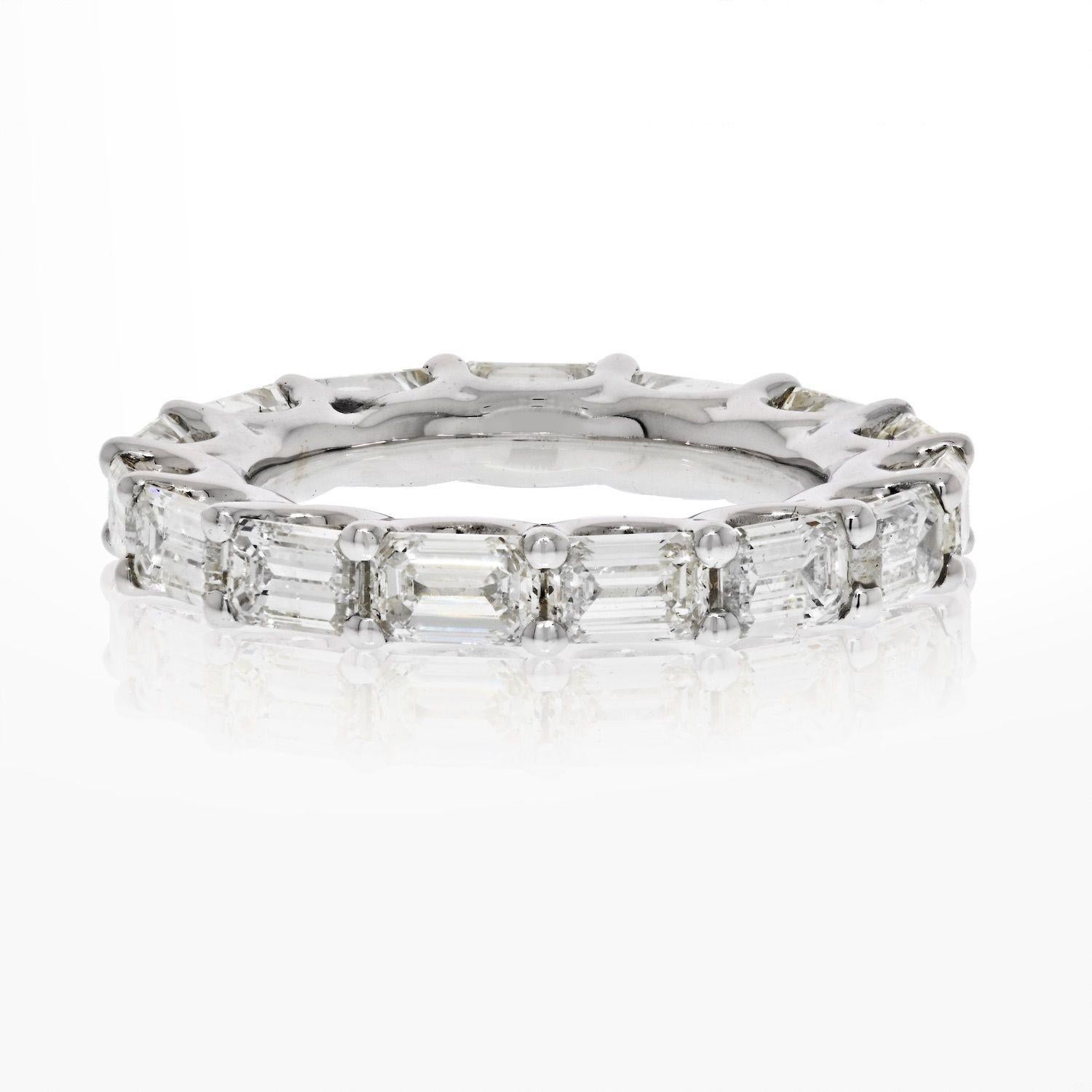 Lovely eternity band to add to your collection: 5.50cts Horizontal Emerald Cut Diamond Eternity Eternity Band in 14k white gold. Mounted in U-style setting with shared prongs. Size 7. 
Diamond Color: G-H, Diamond Clarity: VS-SI.