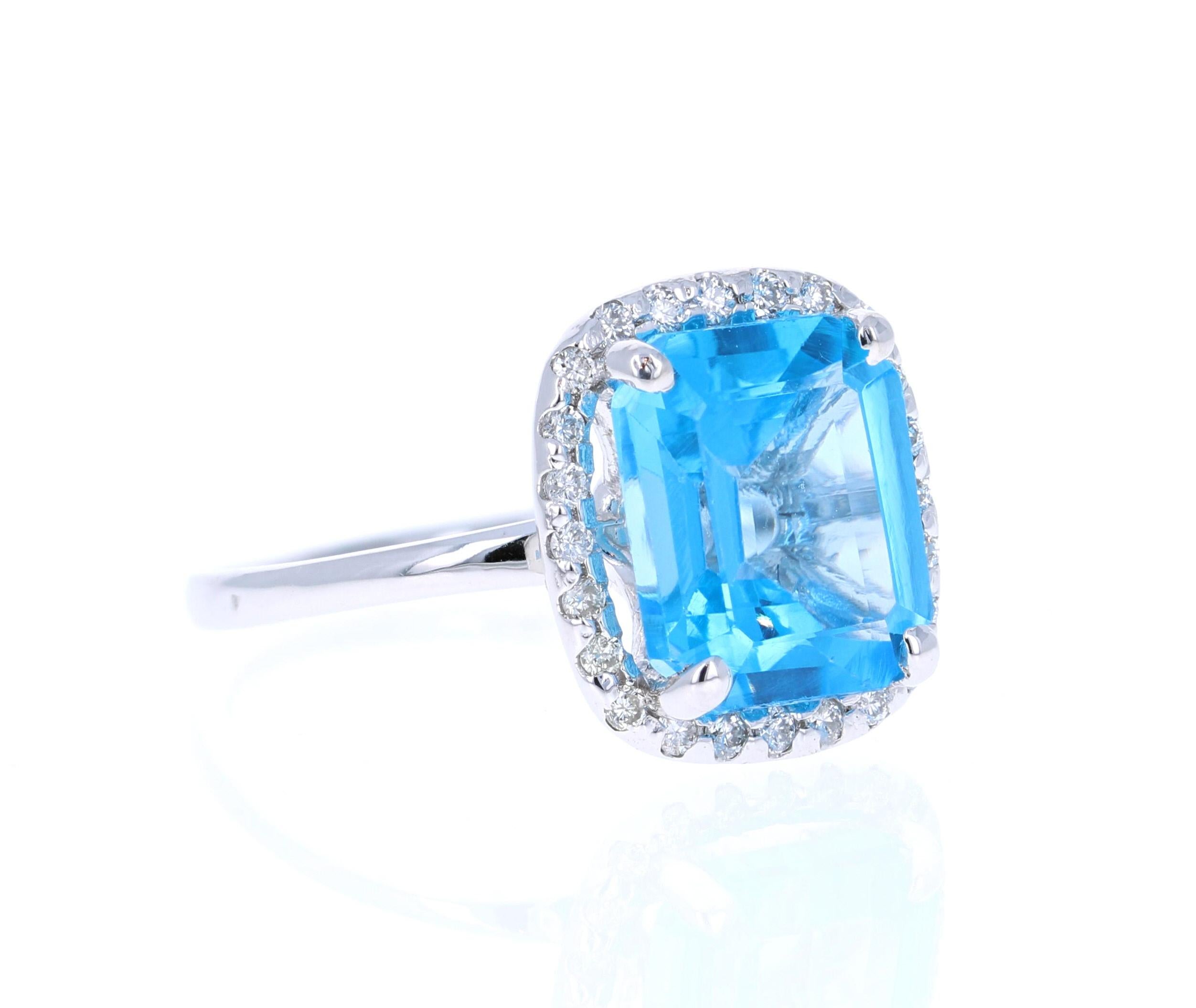 This Oval Cut Blue Topaz Diamond ring has a 5.27 Carat Blue Topaz and is surrounded by 24 Round Cut Diamonds that weigh 0.24 Carats. The total carat weight of the ring is 5.51 Carats. (Clarity of Diamonds: SI, Color of Diamonds: F) 

The setting is