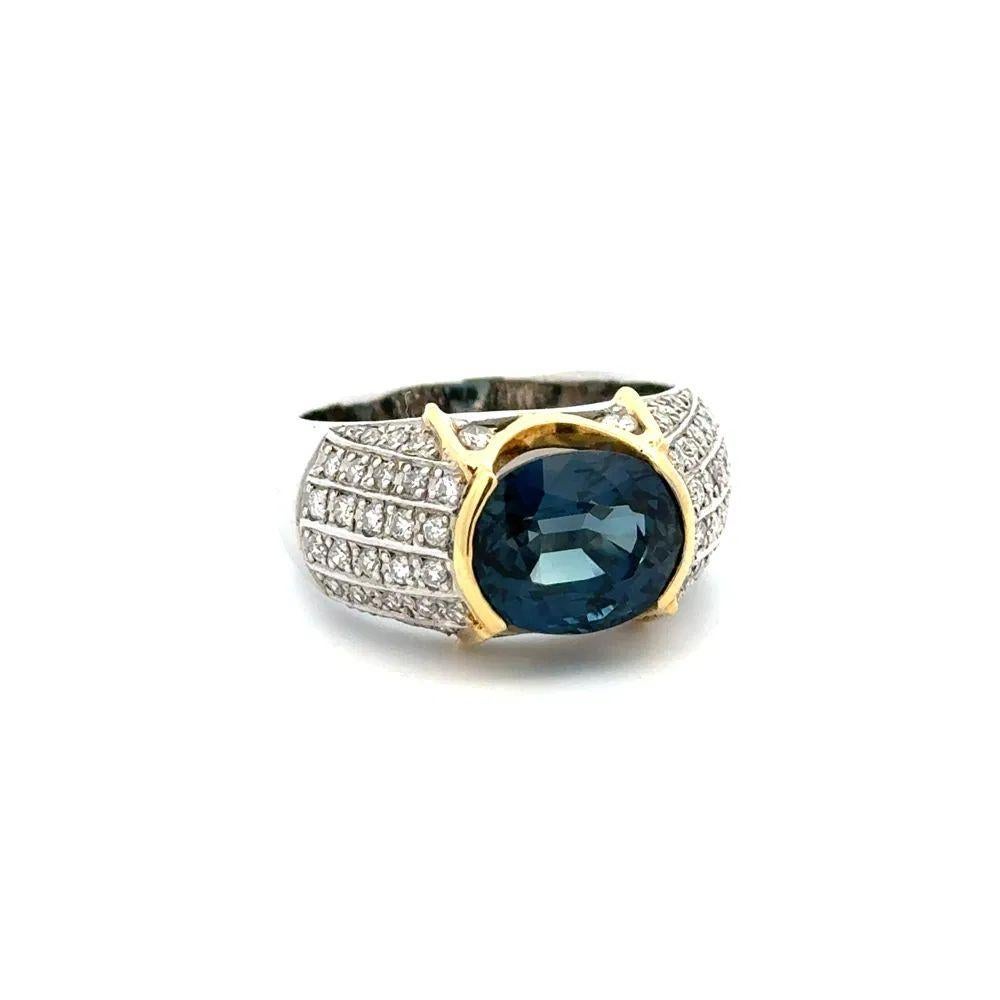 Simply Beautiful! Oval Blue Sapphire and Diamond Platinum Cocktail Ring. Centering a securely Hand set 5.52 Carat East West Oval Blue Sapphire, enhanced either side with Diamonds, weighing approx. 0.80tcw. Hand crafted in Platinum and 18K Yellow
