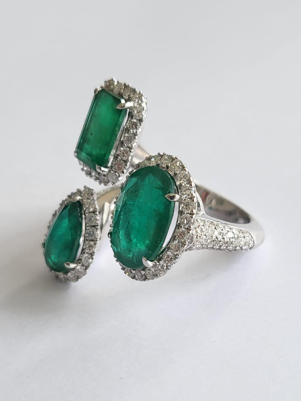 Oval Cut 5.52 Carats, Natural Zambian Emerald & Diamonds Three Stone Cocktail Ring