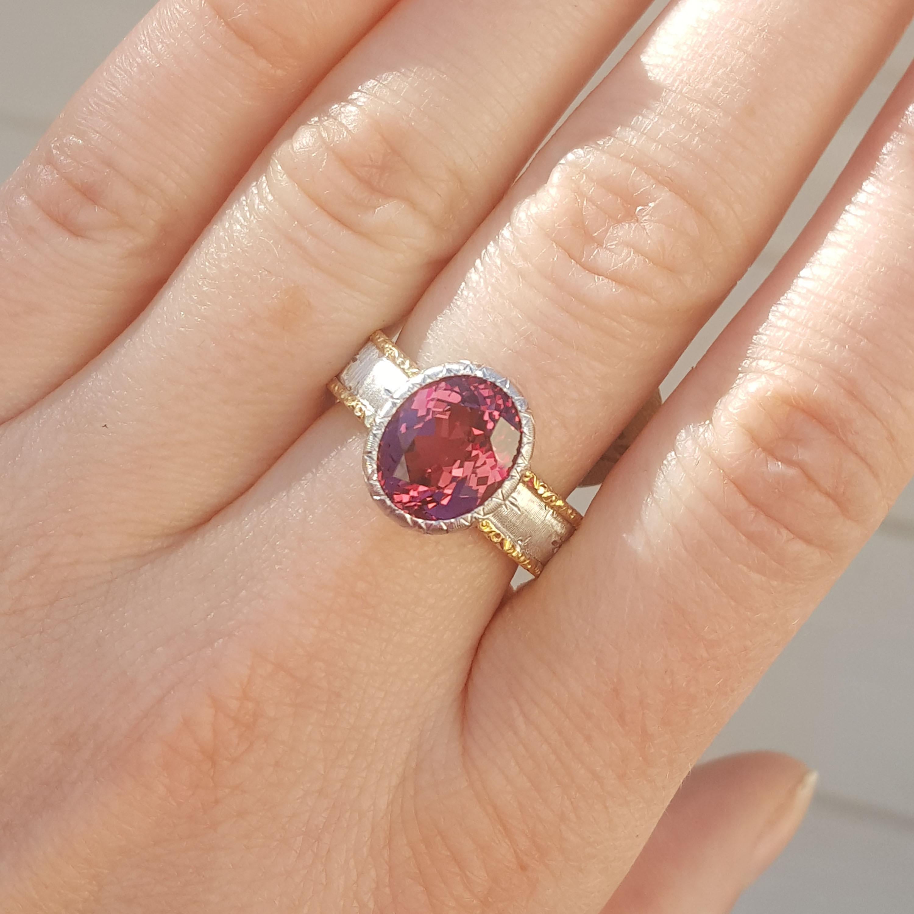 This richly hued Malaya Garnet from Tanzania is a striking and dramatic color; it could be described as a burgundy-rose, and it is incredibly flattering on every skin tone.  This exceptional and rare variety of garnet is an exceptional example of