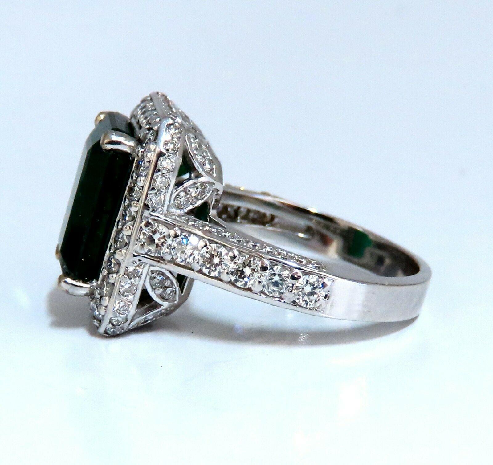 Halo Mod Vivid Green.

4.12ct. Natural Emerald Ring

Emerald cut Brilliant 

11.8 x 8.4mm 

Transparent & Vivid Green 

1.40ct. Diamonds.

Rounds & full cuts 

G-color Vs-2 clarity.  

14kt. white gold

7.5 grams

Ring Current size: 6.5

Depth of