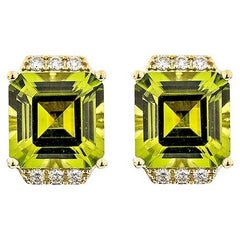 5.53 carat Peridot stud Earrings in 18 Karat Yellow Gold with White Diamond.