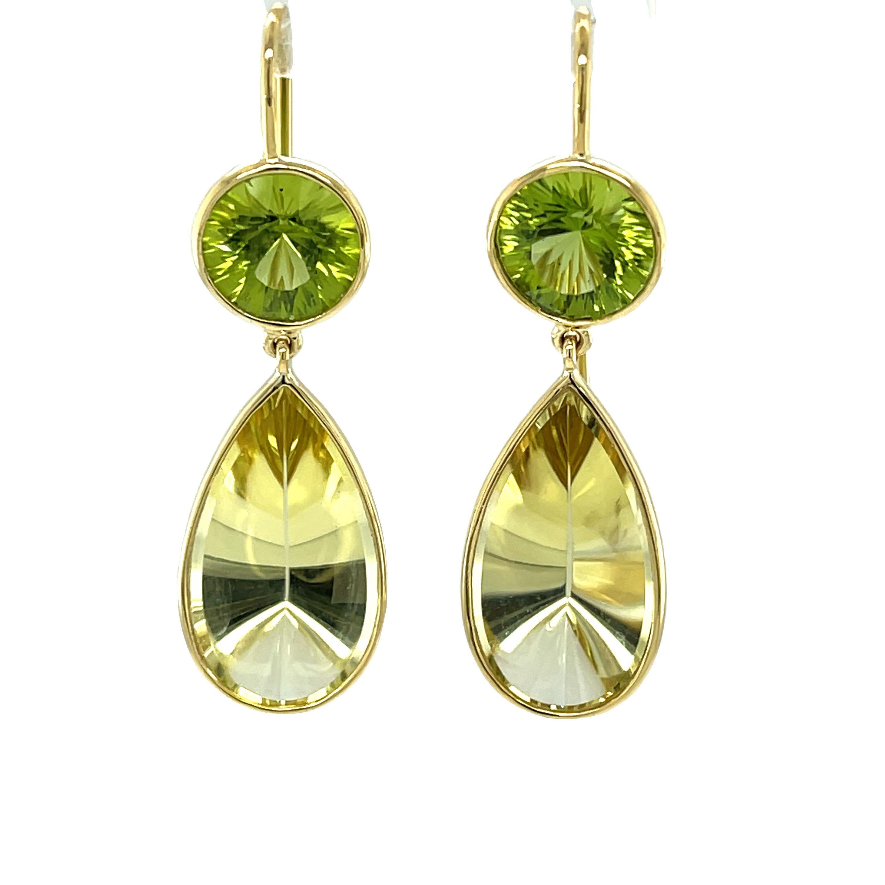 These pretty and unusual peridot and citrine dangle earrings are so modern and fun! Bright green peridot rounds are paired with fantasy-cut citrine pears in a bright 