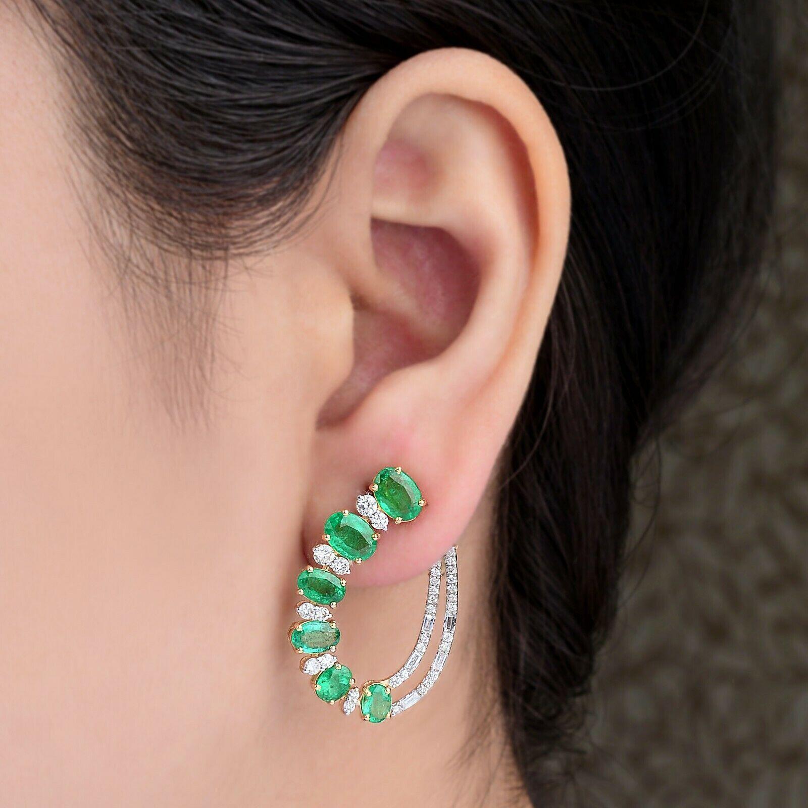 Cast in 14-karat gold, these beautiful double hoop earrings are hand set with 5.53 carats of emerald and 1.20 carats of sparkling diamonds. 

FOLLOW  MEGHNA JEWELS storefront to view the latest collection & exclusive pieces.  Meghna Jewels is