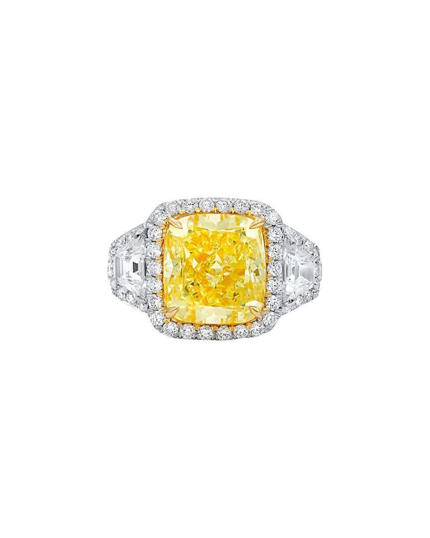 Platinum Three stone diamond engagement ring, 5.54 Carats Fancy Yellow VS2 in Clarity EGL Certified, Set with 2.00 Carats of diamonds on the side. 