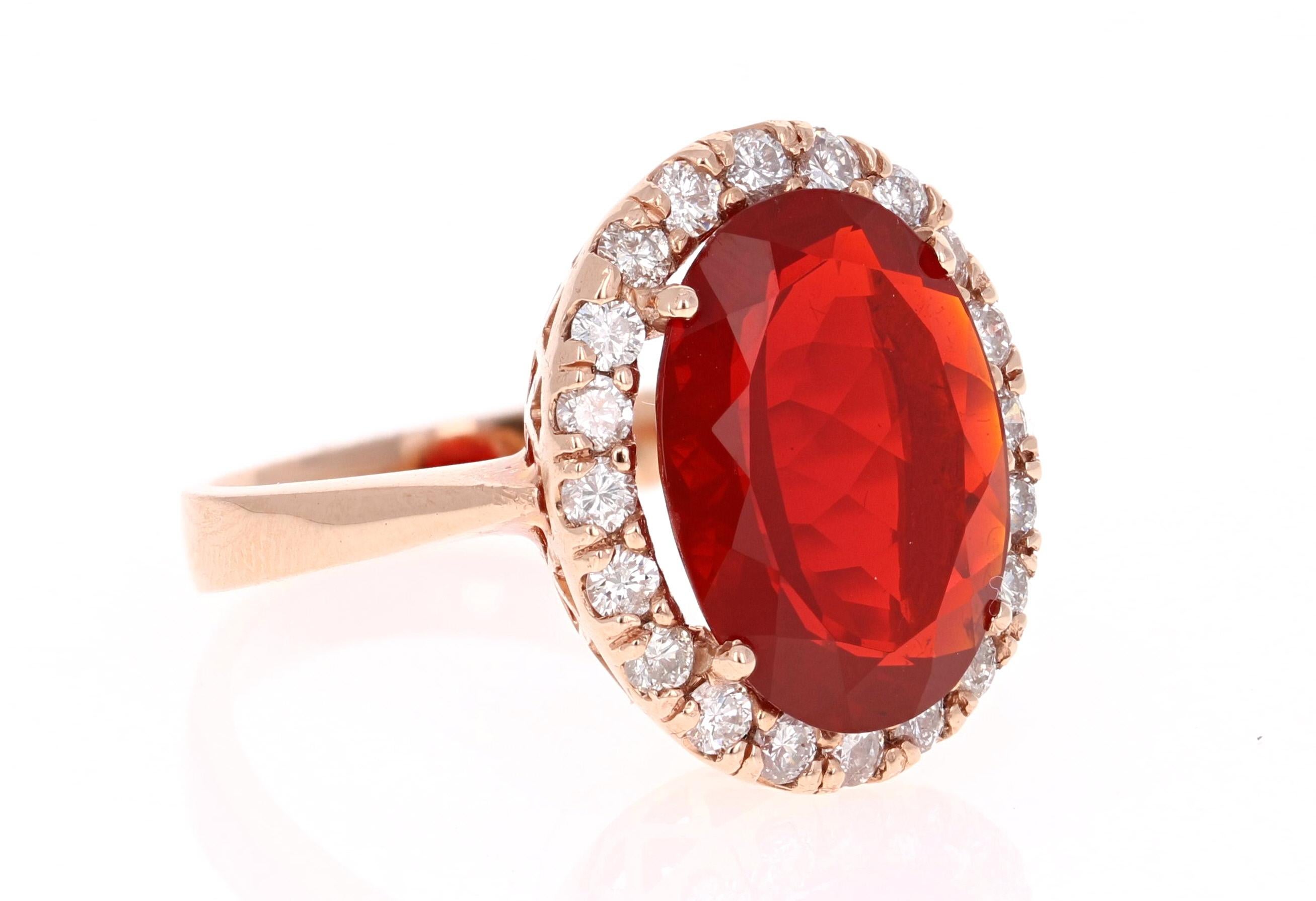 Beautiful Red Fire Opal and Diamond Ring. This ring has a 4.73 carat Fire Opal in the center of the ring and is surrounded by a halo of 21 Round Cut Diamonds that weigh a total of 0.81 carat.  The total carat weight of the ring is 5.54 carats. 