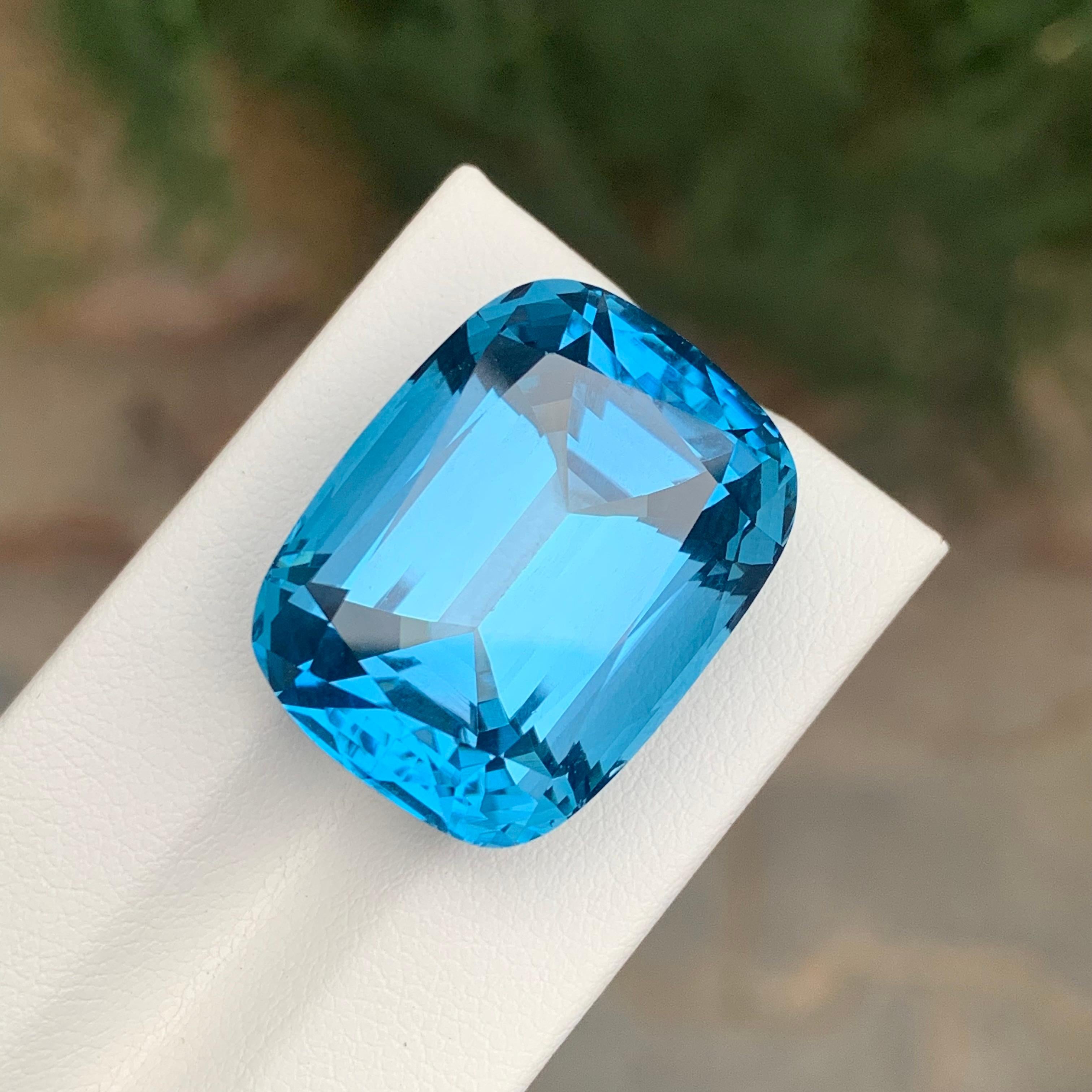 Loose London Blue Topaz

Weight: 55.40 Carats
Dimension: 23 x 18 x 14.2 Mm
Origin: Brazil
Shape: Cushion 
Color: Deep Blue
Certificate: On Customer Demand

London Blue Topaz is a mesmerizing variety of topaz renowned for its deep and enchanting blue