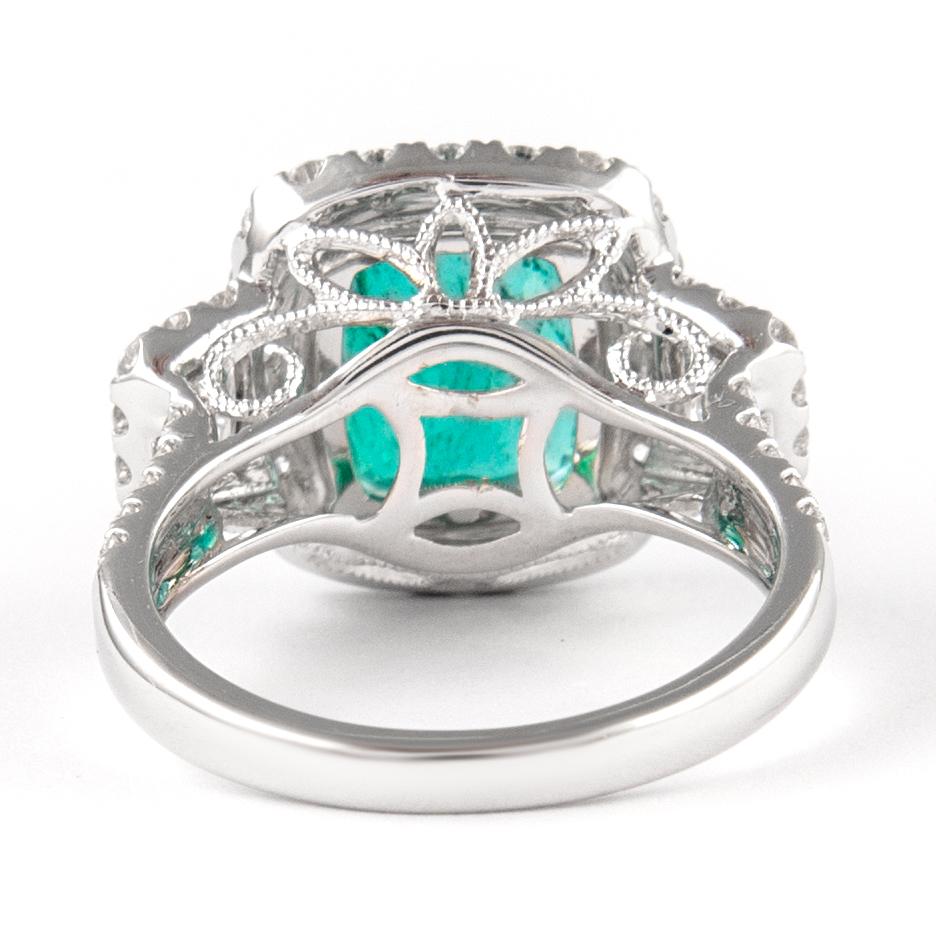 5.54ctt Emerald with Diamond Three Stone Halo Ring 18 Karat Gold In New Condition In BEVERLY HILLS, CA