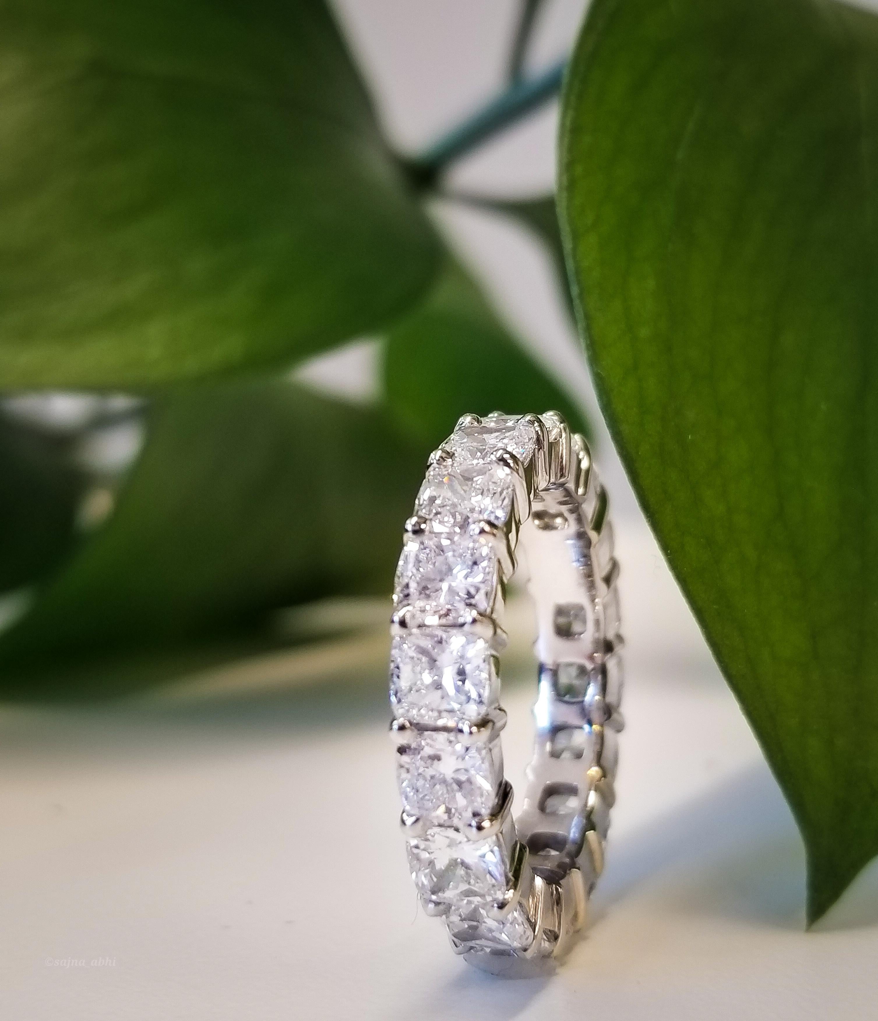 Contemporary 5.55 Carat Total Cushion Cut Diamond Eternity Band in Platinum