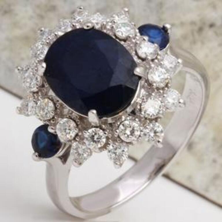 5.55 Carats Exquisite Natural Blue Sapphire and Diamond 14K Solid White Gold Ring

Total Natural Blue Sapphire Weights: Approx. 5.00 Carats

Sapphire Measures: 11 x 9mm

Sapphire Treatment: Diffusion

Natural Round Diamonds Weight: Approx. 0.55