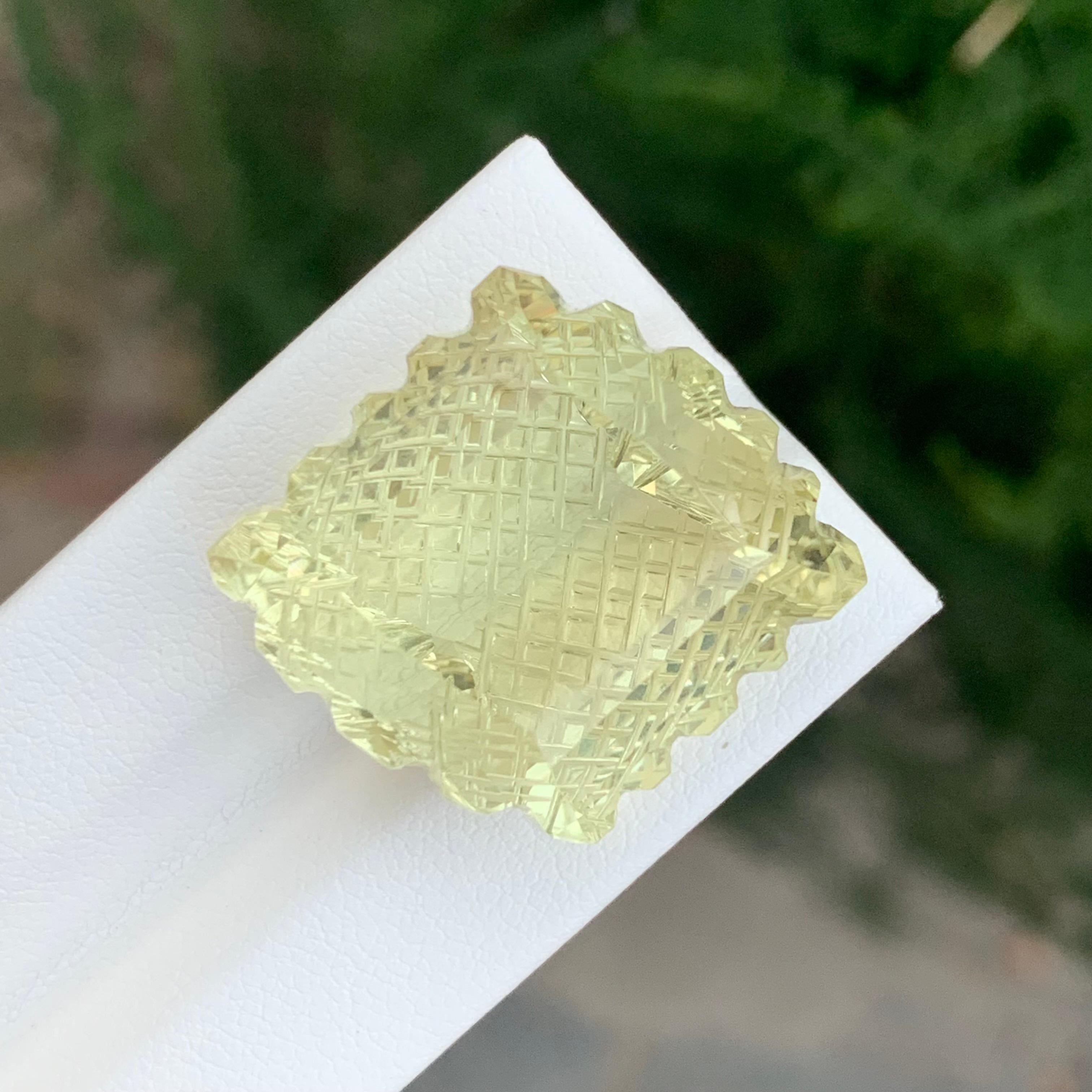 Loose Lemon Quartz Carving 

Weight: 55.50 Carats
Dimension: 23 x 21 x 15.7 Mm
Origin: Brazil
Certificate: On Demand
Colour: Yellow

Lemon quartz citrine, a dazzling gemstone, combines the vibrant hues of lemon quartz with the warm tones of citrine,