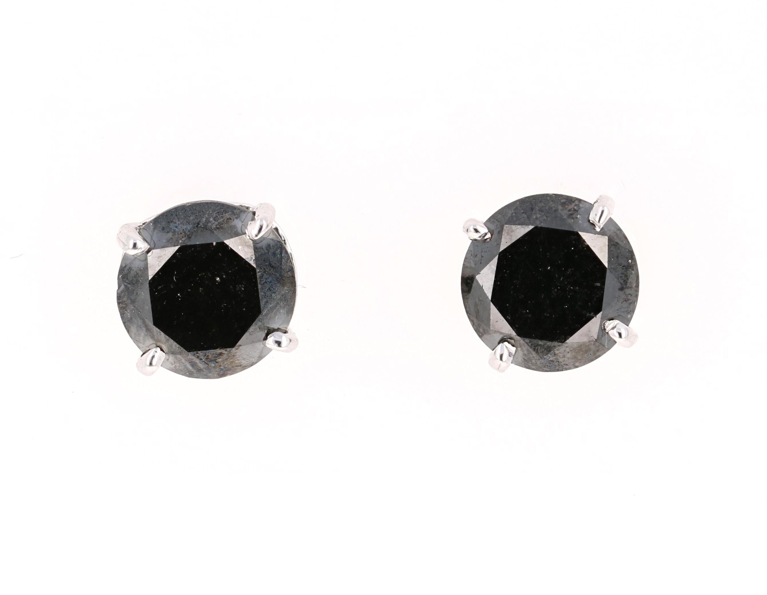 Bomb Black Diamond Studs!

These fun & versatile stud earrings have 2 Black Round Cut Diamonds that weigh 5.56 Carats. 

Curated in 14 Karat White Gold and measure at approximately 9 mm. 
