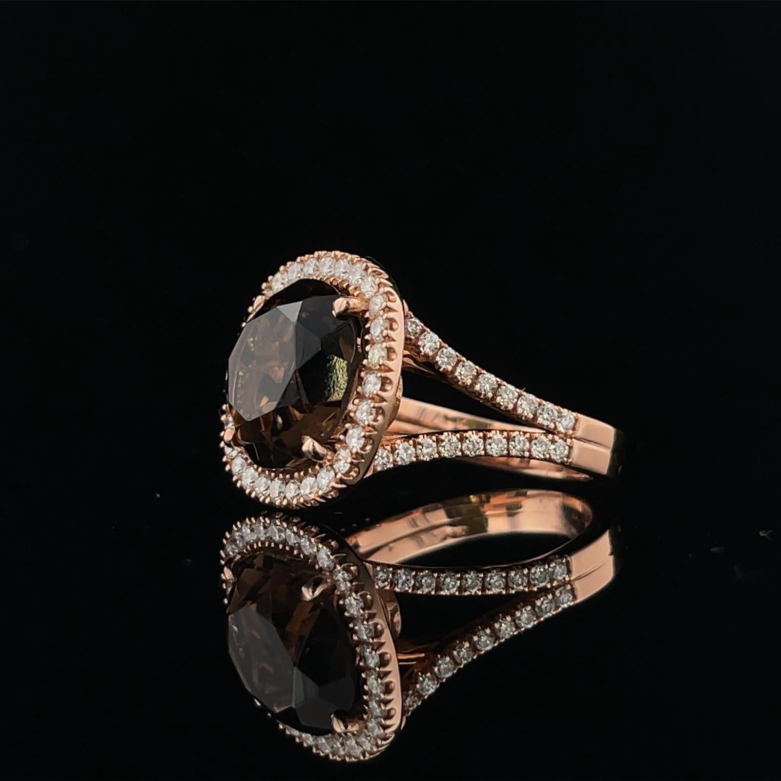 Talk about a show stopper! With a 5.56CT Cushion Cut Smokey Topaz center, this ring hold Sixty-Four (64) Round Diamonds Weighing 0.95CTW all in 14K Rose Gold  
Size 6.5 

Smokey Topaz - 12.2 x 7.1 mm 
Diamonds - 1.6mm & 1.3mm