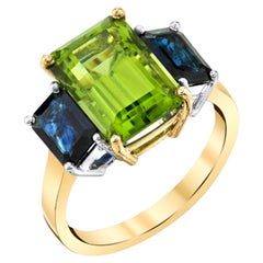5.57 Carat Emerald Cut Peridot and Sapphire Yellow Gold 3-Stone Cocktail Ring